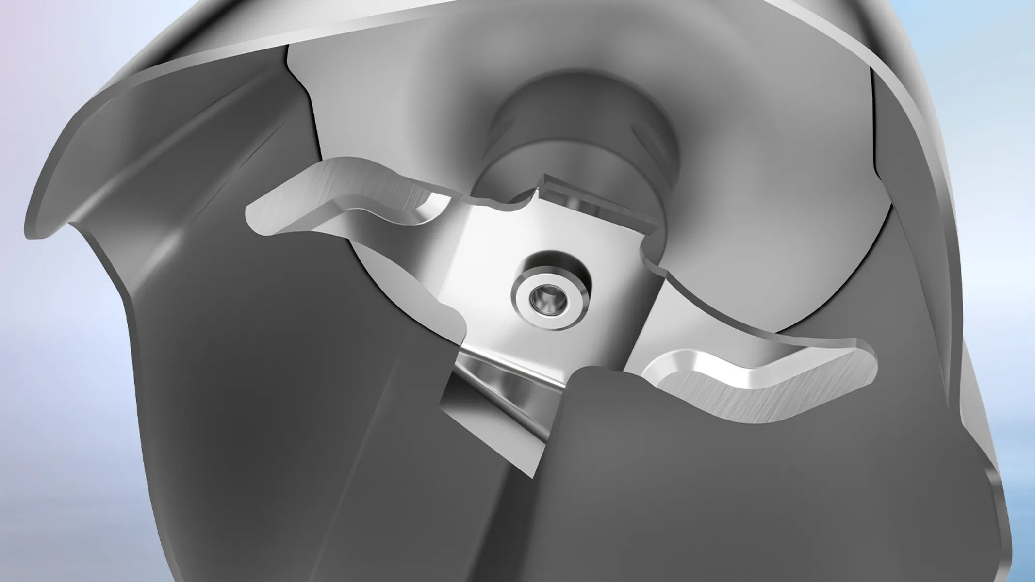 Zbliżenie metalowego ostrza z trzema krawędziami tnącymi. Tło jest jasnoniebieskie i białe.