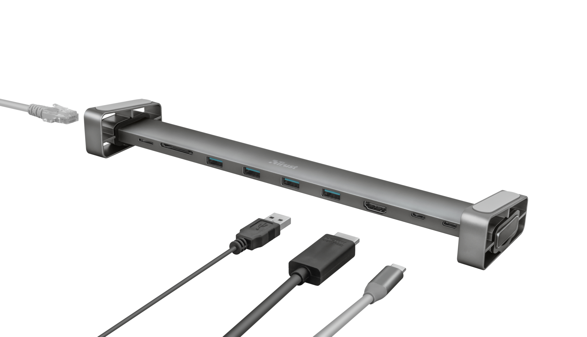 Un hub argentato con più porte e cavi collegati. Ha connessioni USB, HDMI ed Ethernet.