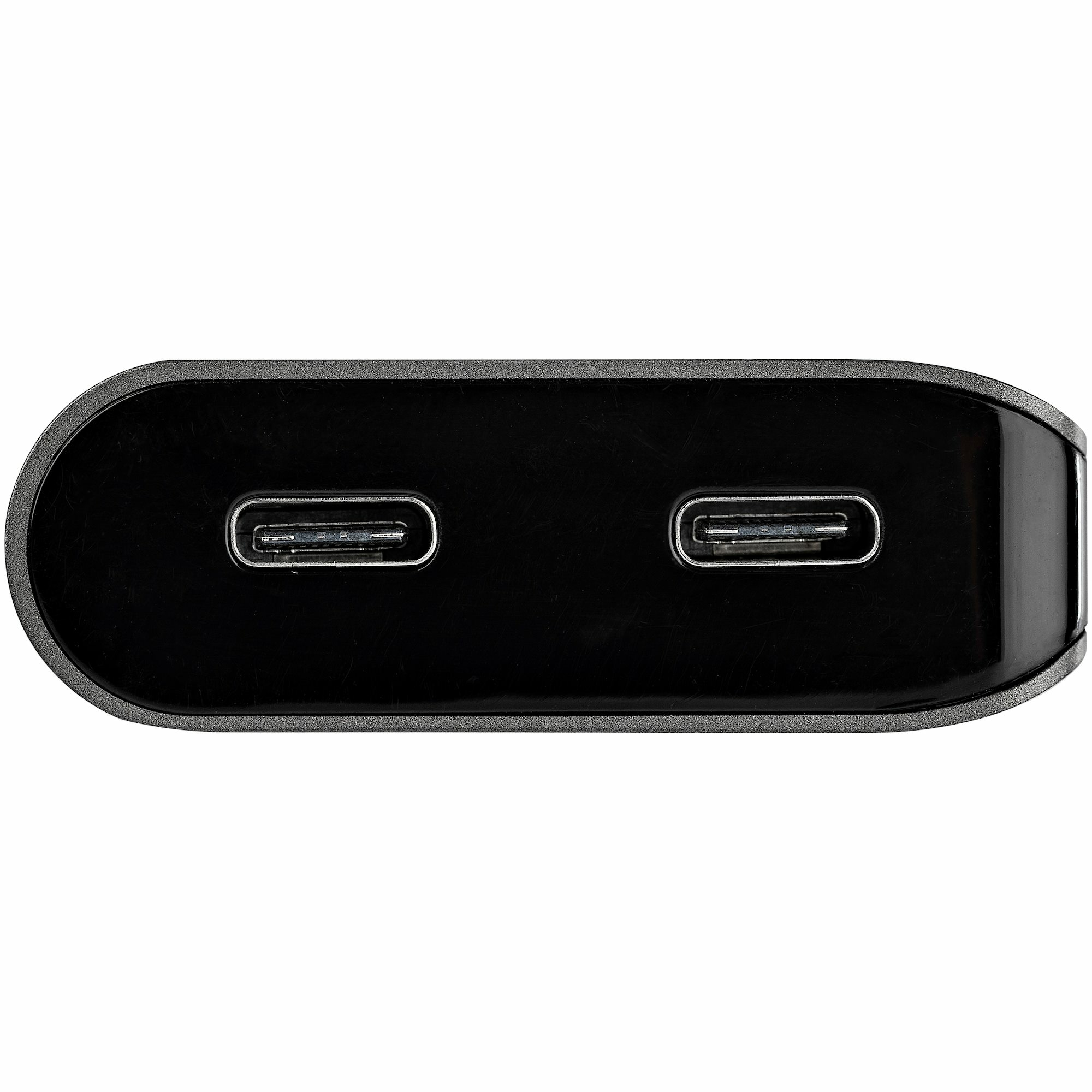 Dispositivo negro con dos puertos USB-C, vista de cerca.