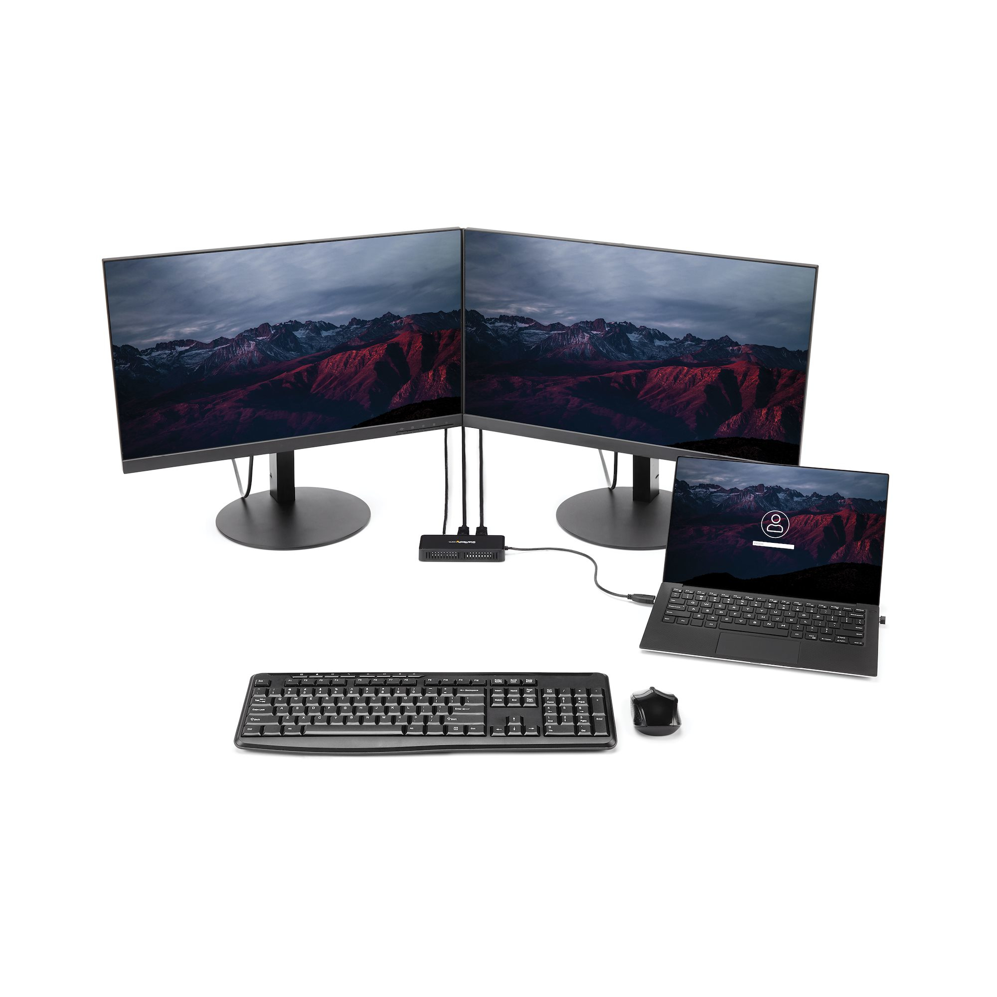 Un setup desktop con due monitor, un laptop, tastiera e mouse. Tutti gli elementi sono neri.