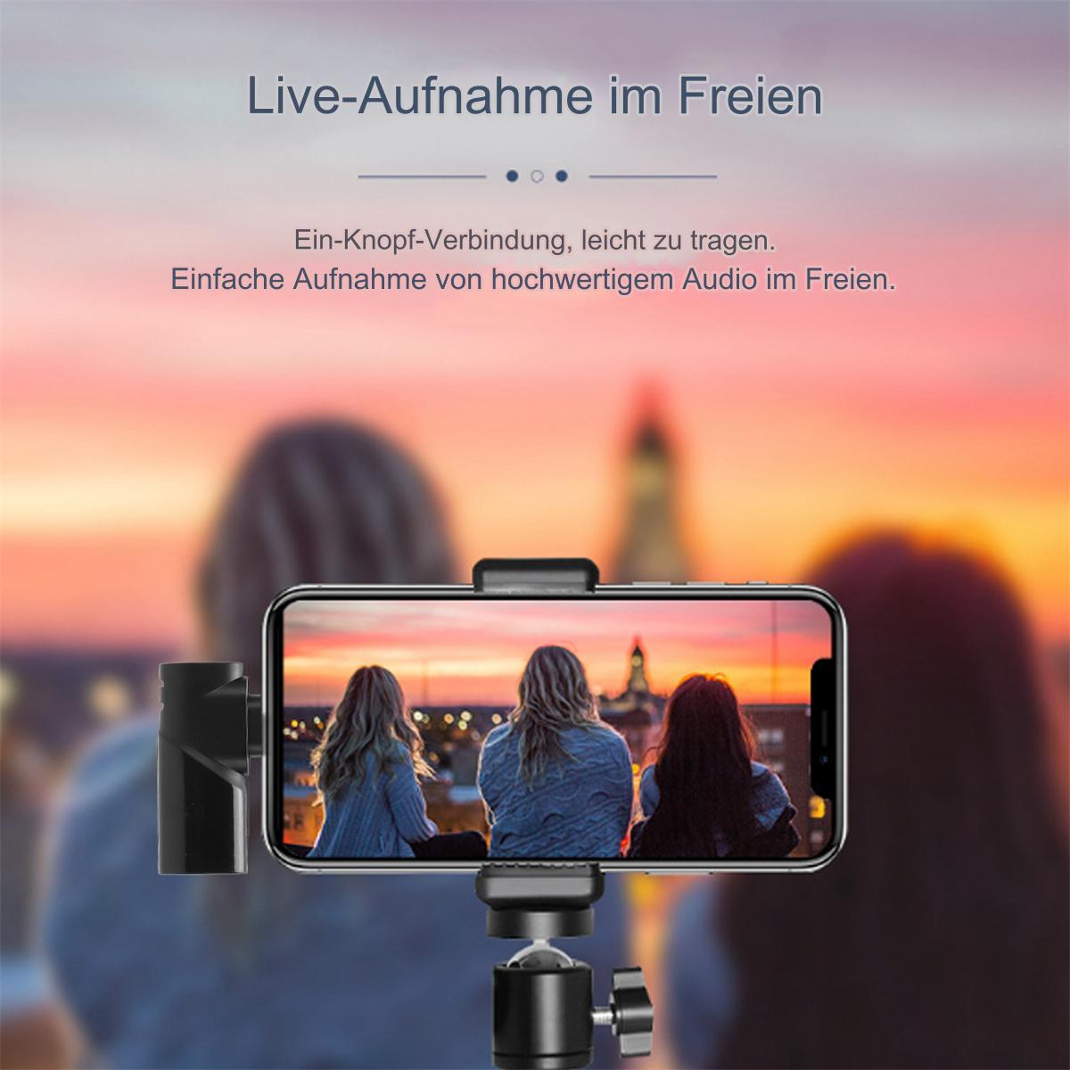 Ein Telefon ist auf einem Stativ montiert und zeigt ein Video von drei Frauen mit einem verschwommenen Hintergrund eines Sonnenuntergangs.