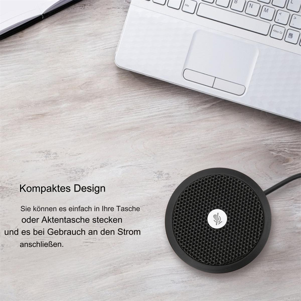 Schwarzes, kompaktes Mikrofon mit rundem Kopf, auf einem Holztisch in der Nähe eines Laptops platziert.
