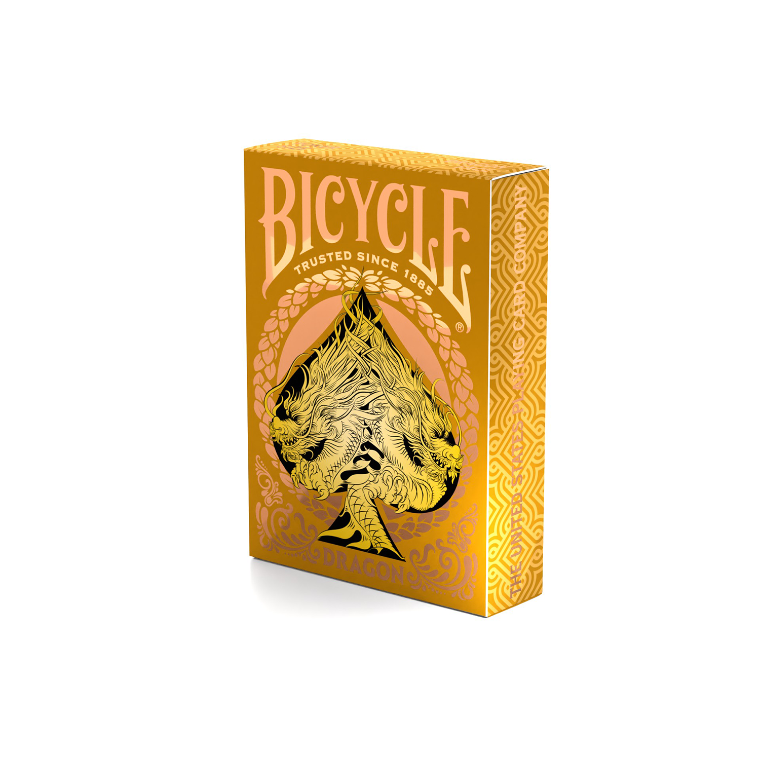 Eine goldene Bicycle Spielkartenbox mit Pik-Design und Drachenkunstwerk.