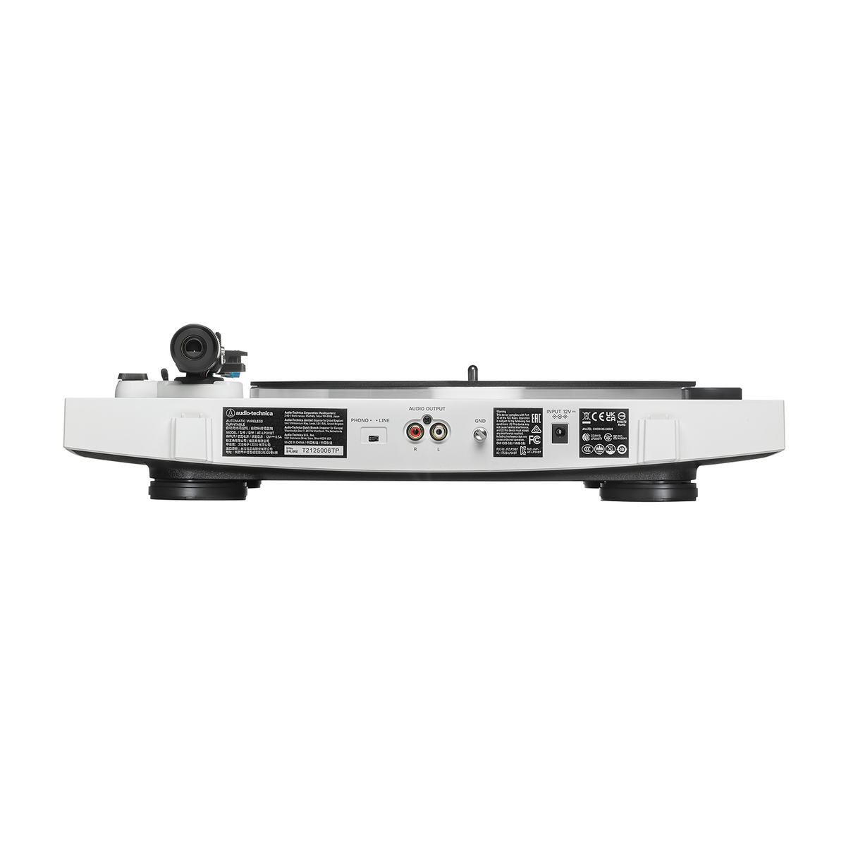 Tocadiscos blanco con plato negro y brazo fonocaptor. Vista lateral con etiquetas.