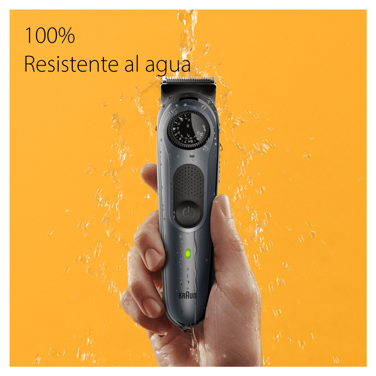 Un recortador de barba negro con gotas de agua, sobre fondo naranja.