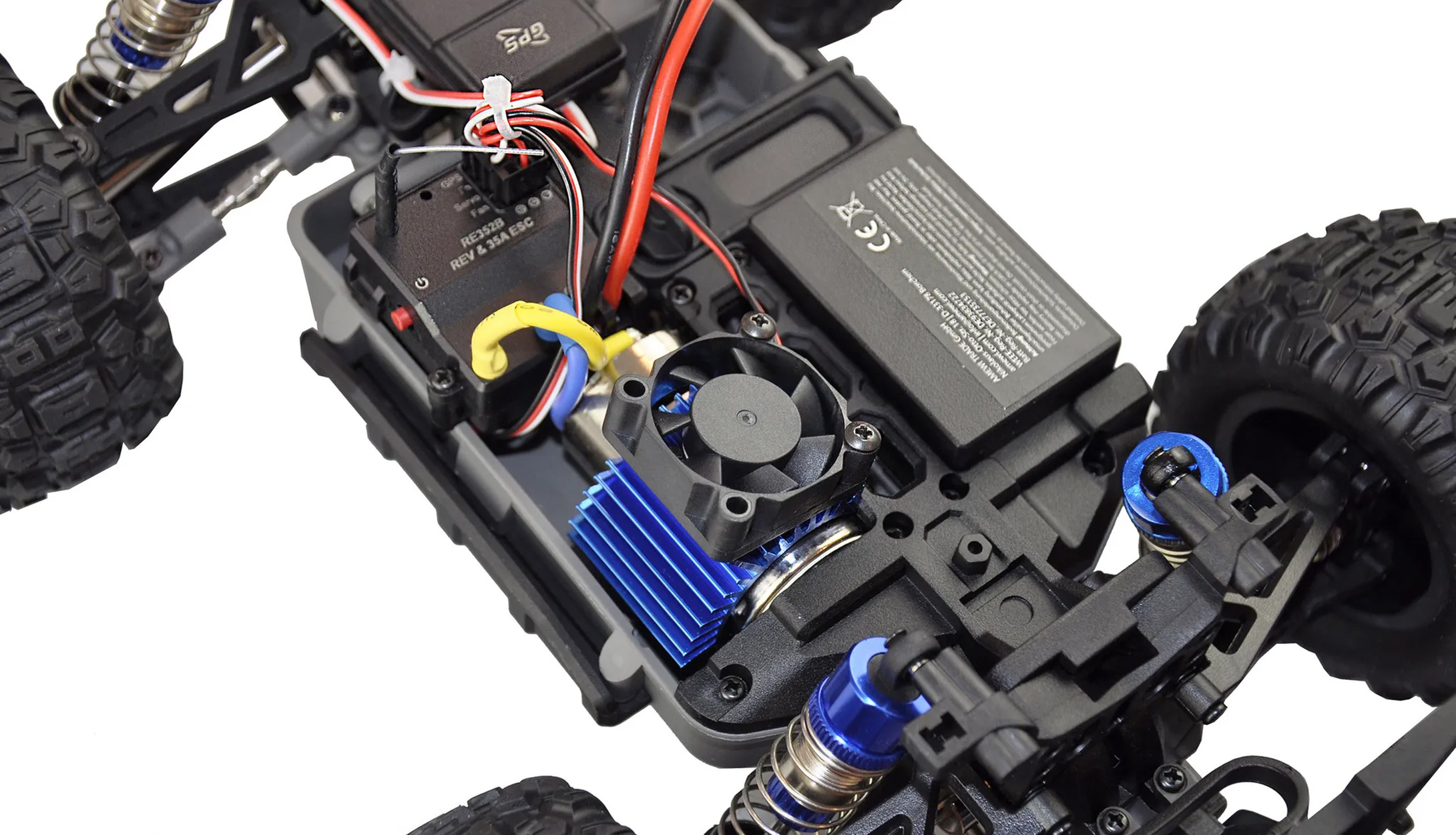 Las partes internas de un coche RC. Incluye motor, ventilador y batería.