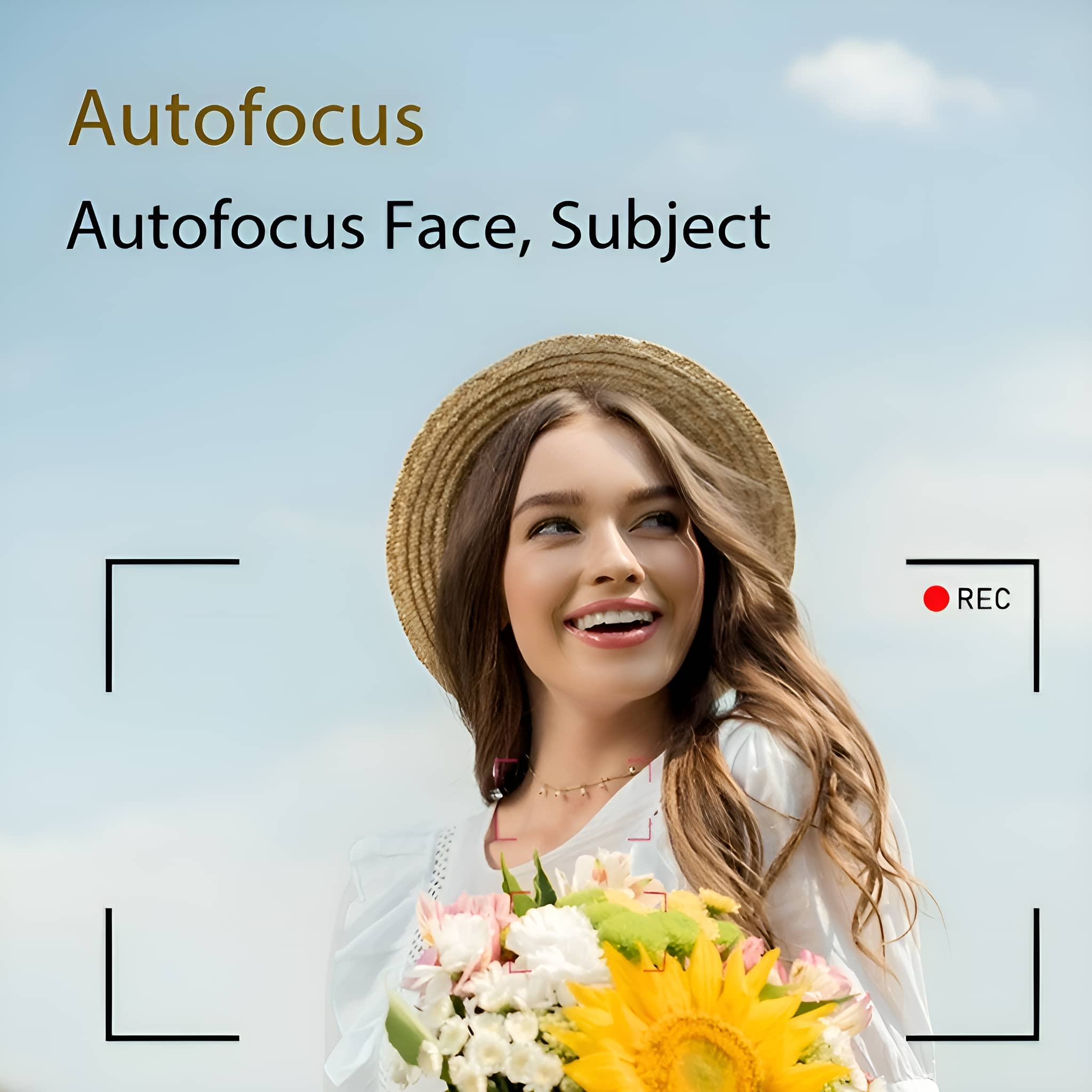 Frau mit Hut hält Blumen und lächelt. Autofokus-Text und roter REC-Kasten sind im Blick. Blauer Himmel im Hintergrund.