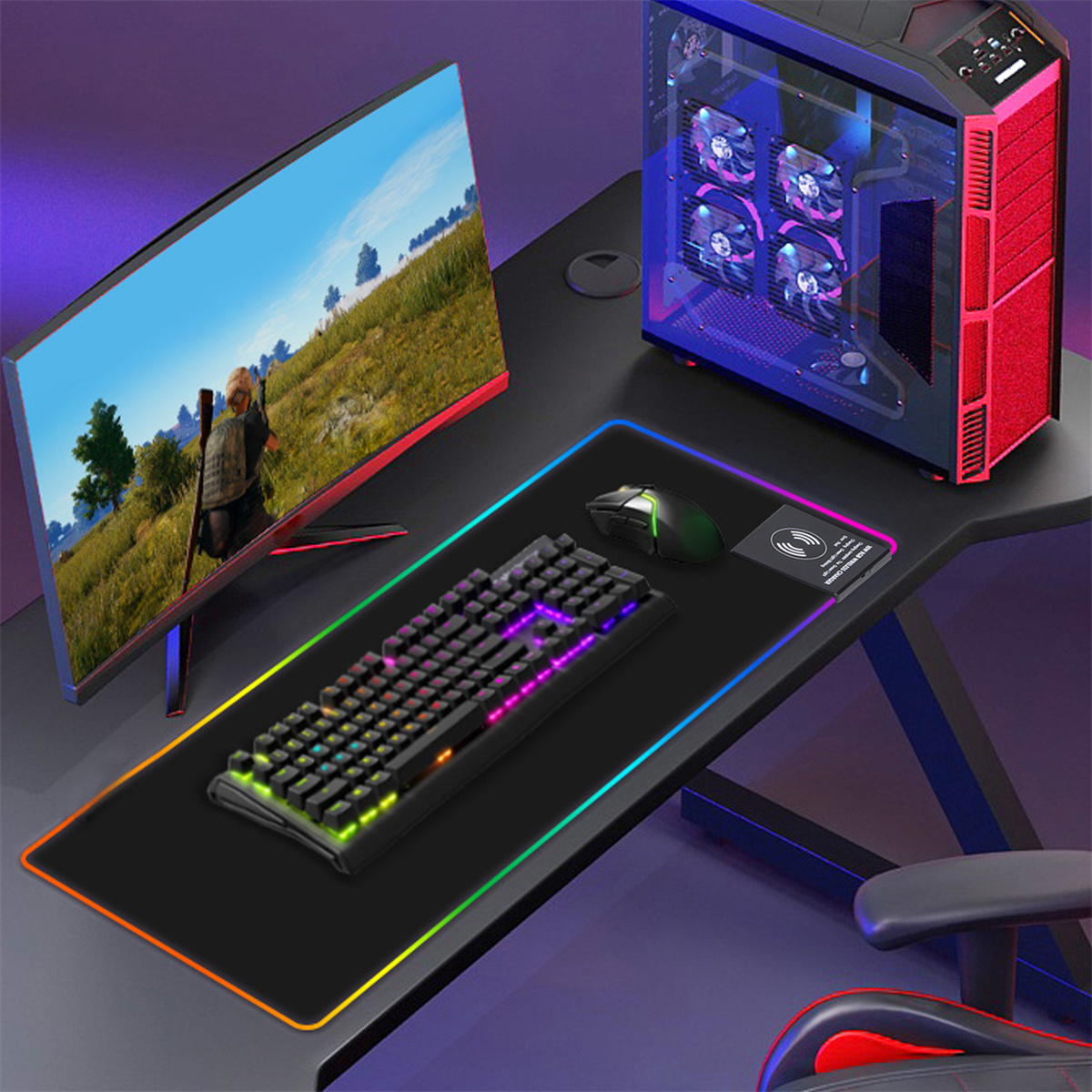 Gaming-Setup mit Monitor, Tastatur, Maus und Computergehäuse. Farbenfrohe Lichter auf den Peripheriegeräten.