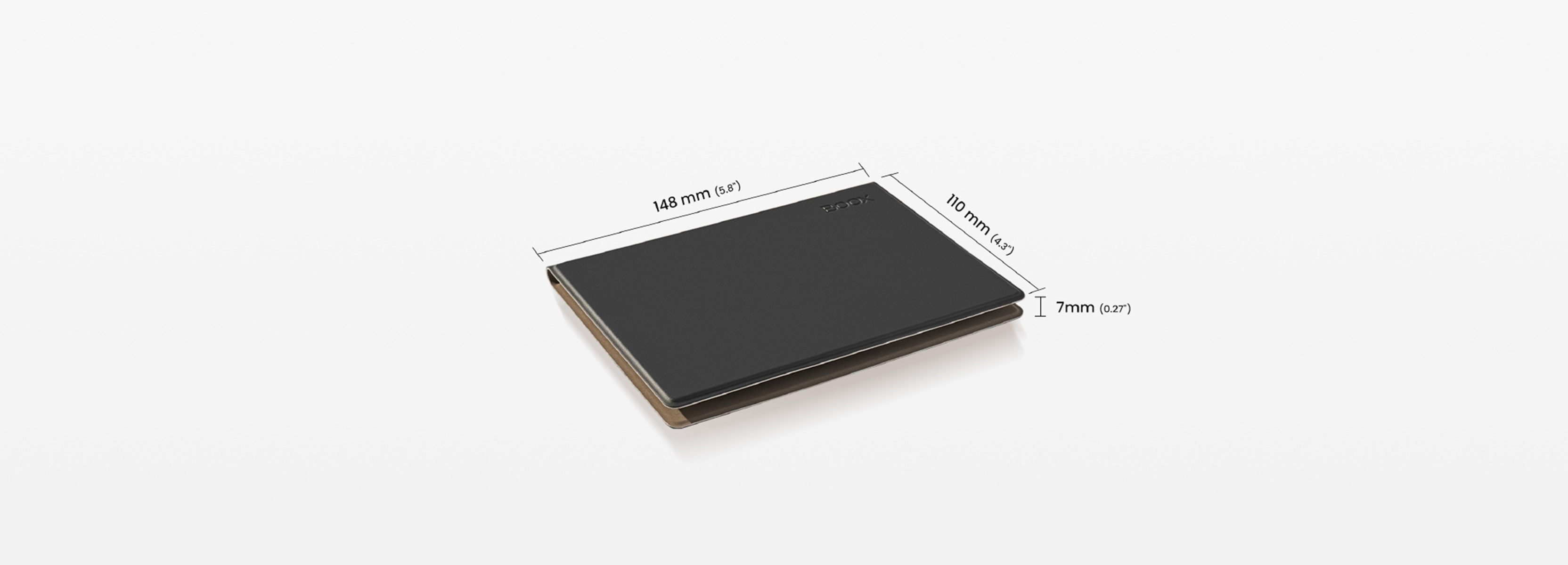 Una tableta negra cerrada con dimensiones en milímetros, sobre una superficie blanca.