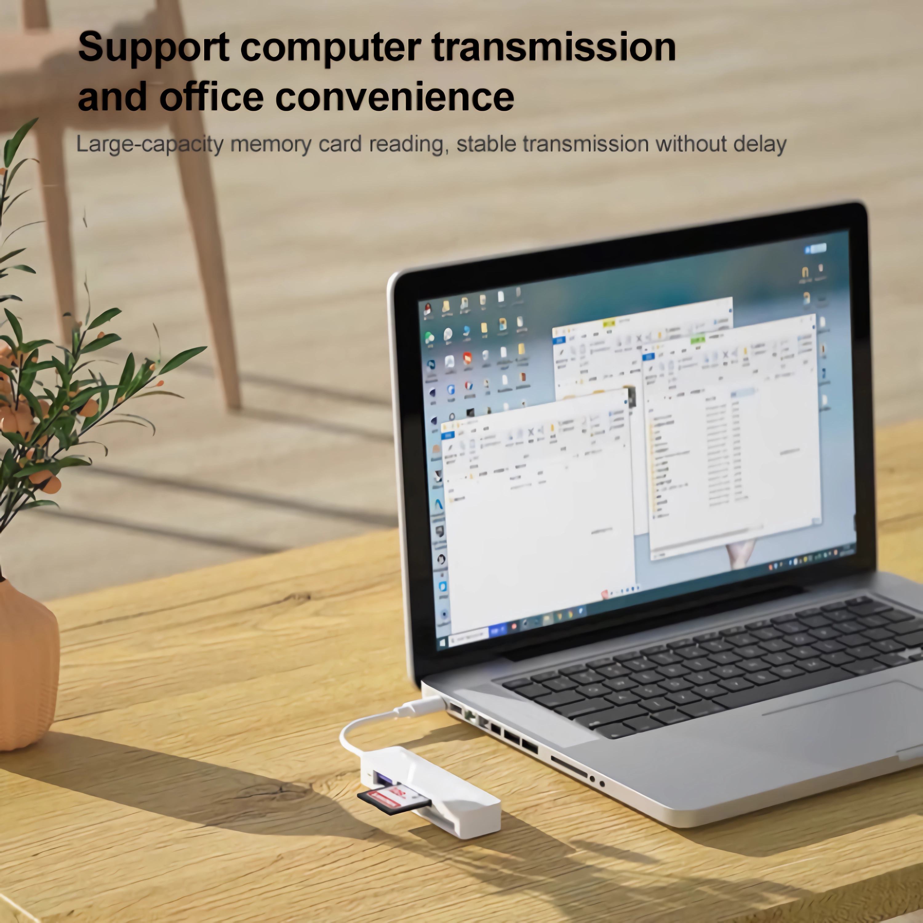 Laptop mit einem weißen Kartenleser auf einem Holztisch verbunden. Der Text lautet: unterstützt Computerübertragung.