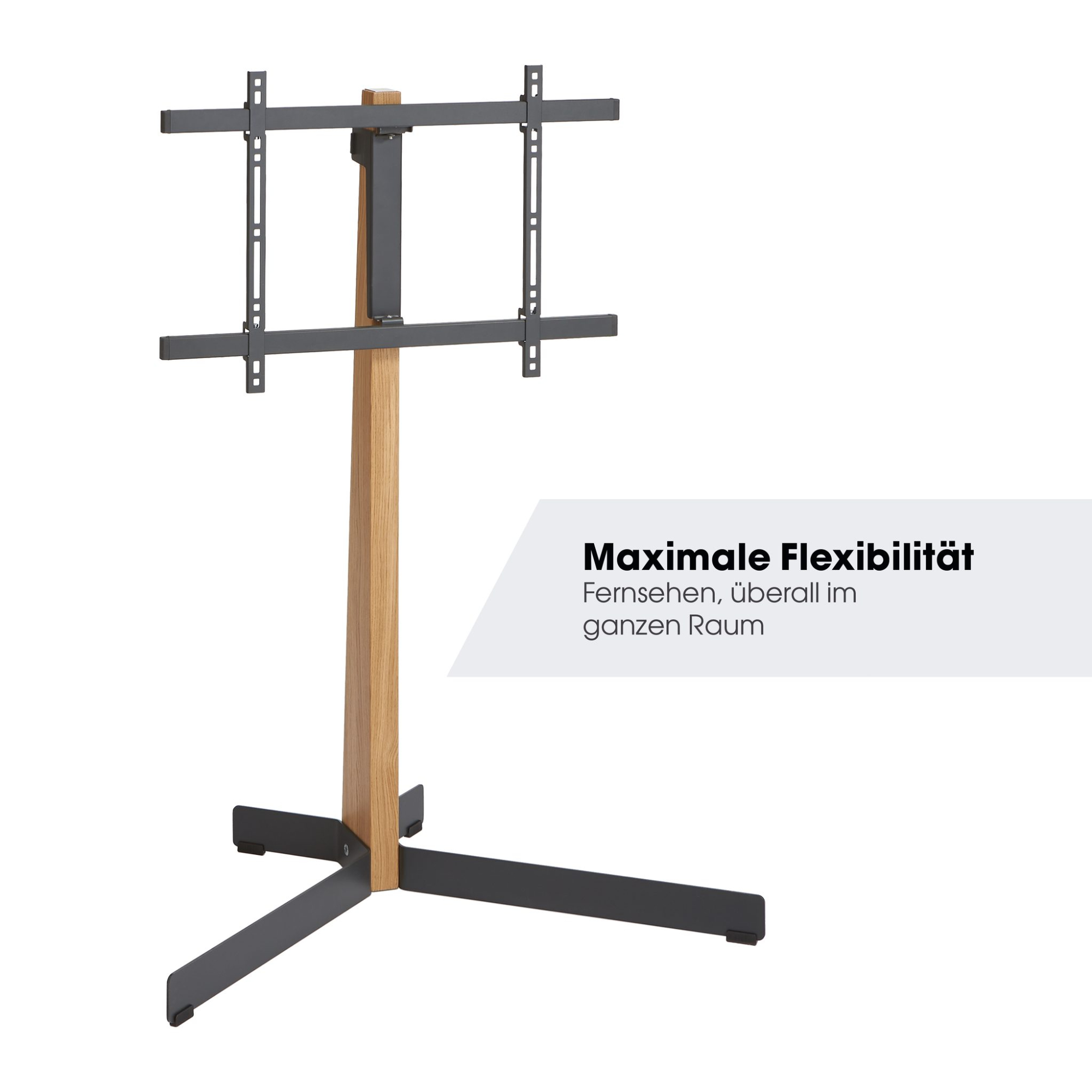 Stojak pod telewizor z drewnianym słupkiem i czarną podstawą. Stojak trzyma uchwyt do telewizora.