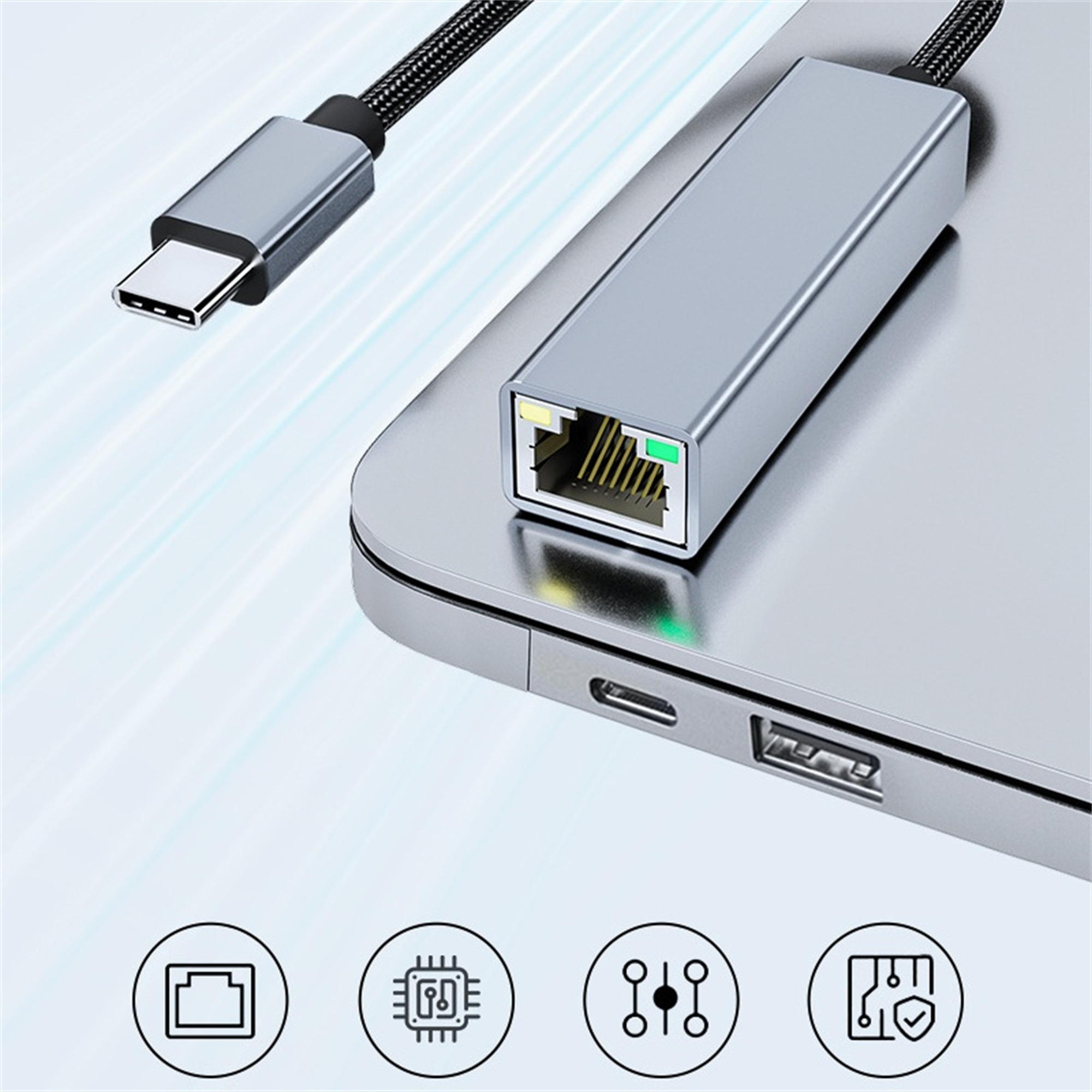 Ein silberner Ethernet-Adapter, der mit einem Laptop verbunden ist, mit Funktionssymbolen.
