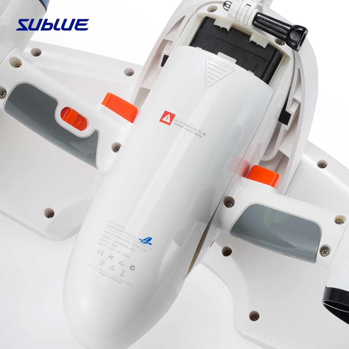 The inside of a Sublue underwater scooter. White with orange accents, and a battery compartment.
