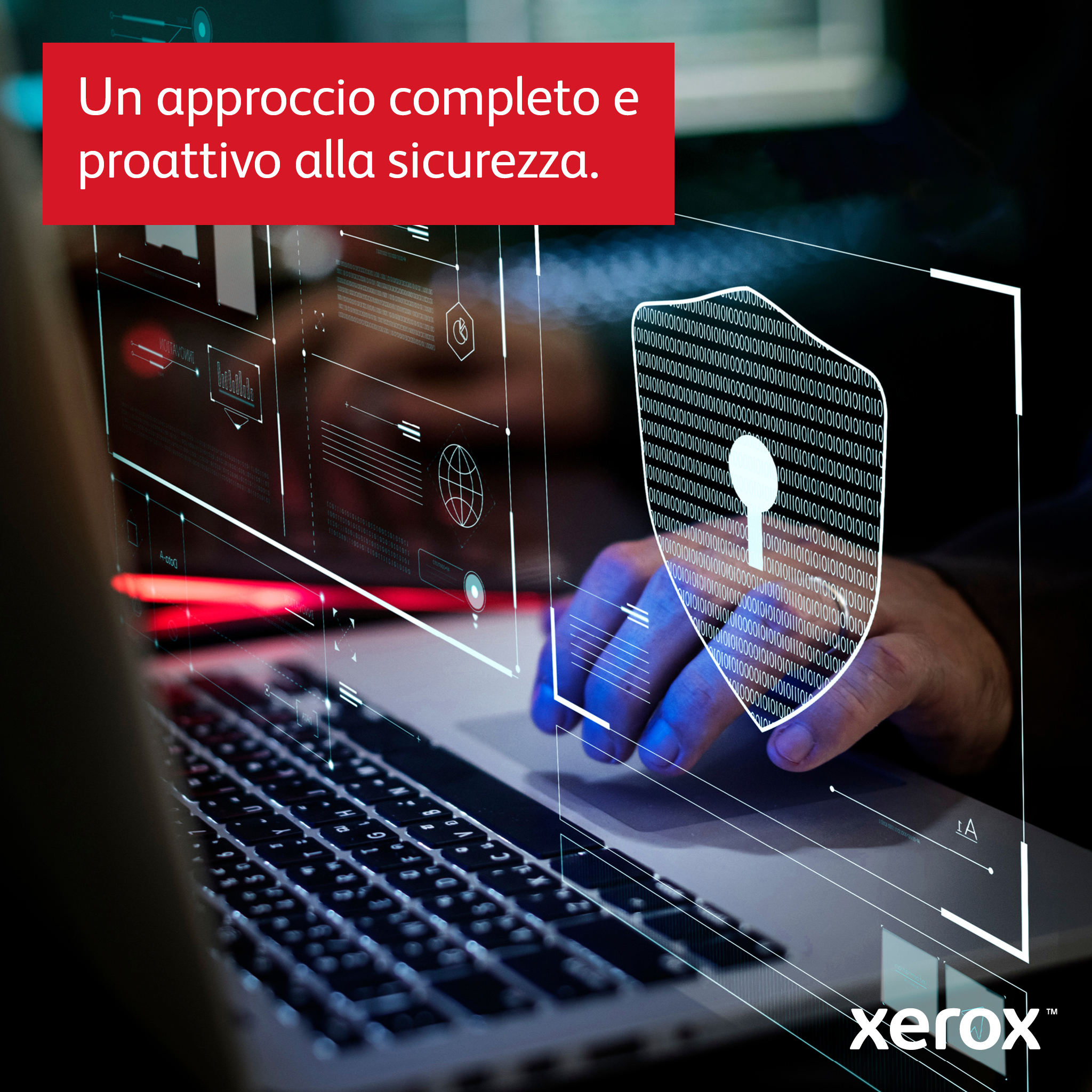 Pantalla de portátil con gráfico de escudo de seguridad, manos en el teclado, con marca Xerox.