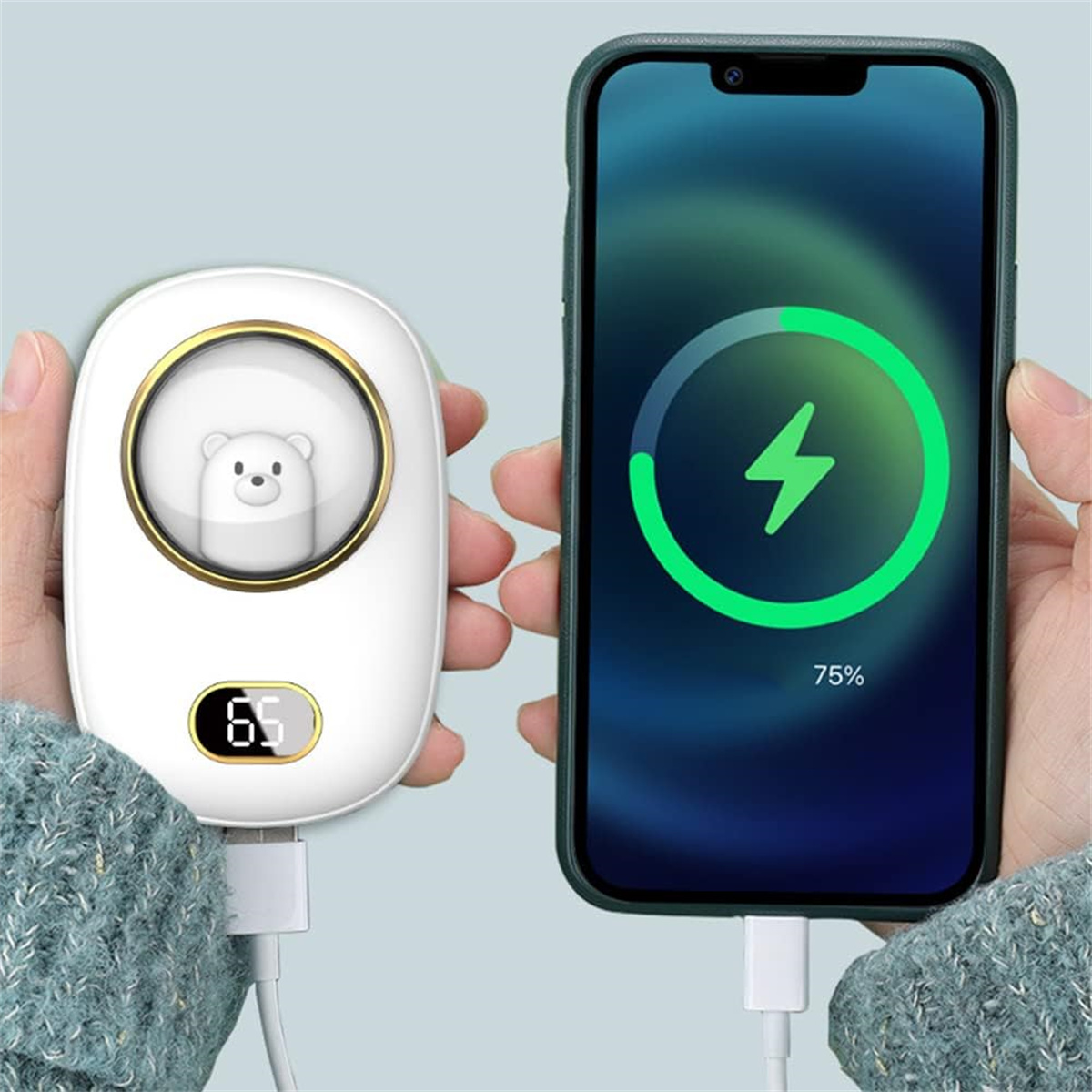 Ein weißer Handwärmer lädt ein Telefon, grünes Batteriesymbol zeigt 75%.