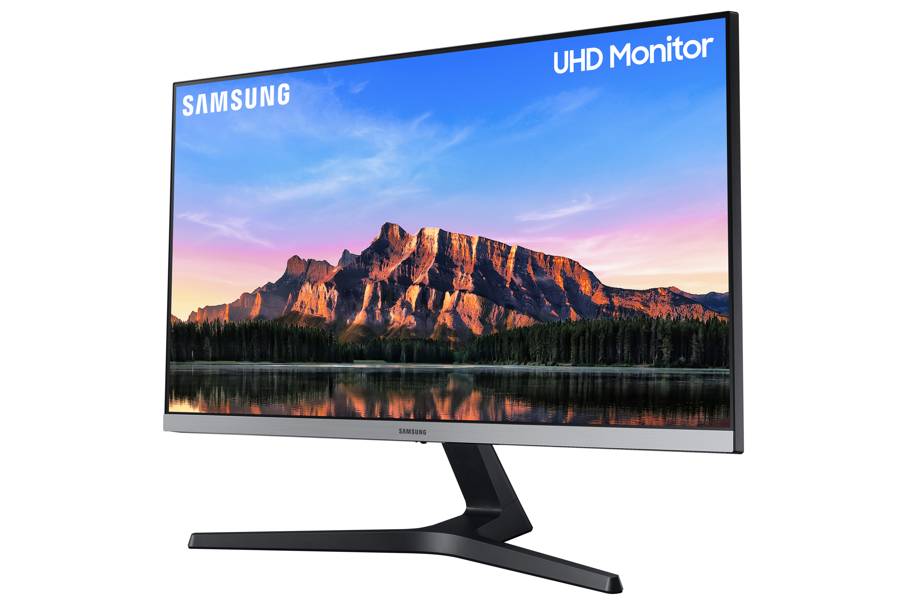Monitor Samsung UHD que muestra un paisaje. Tiene un bisel delgado y un soporte negro.