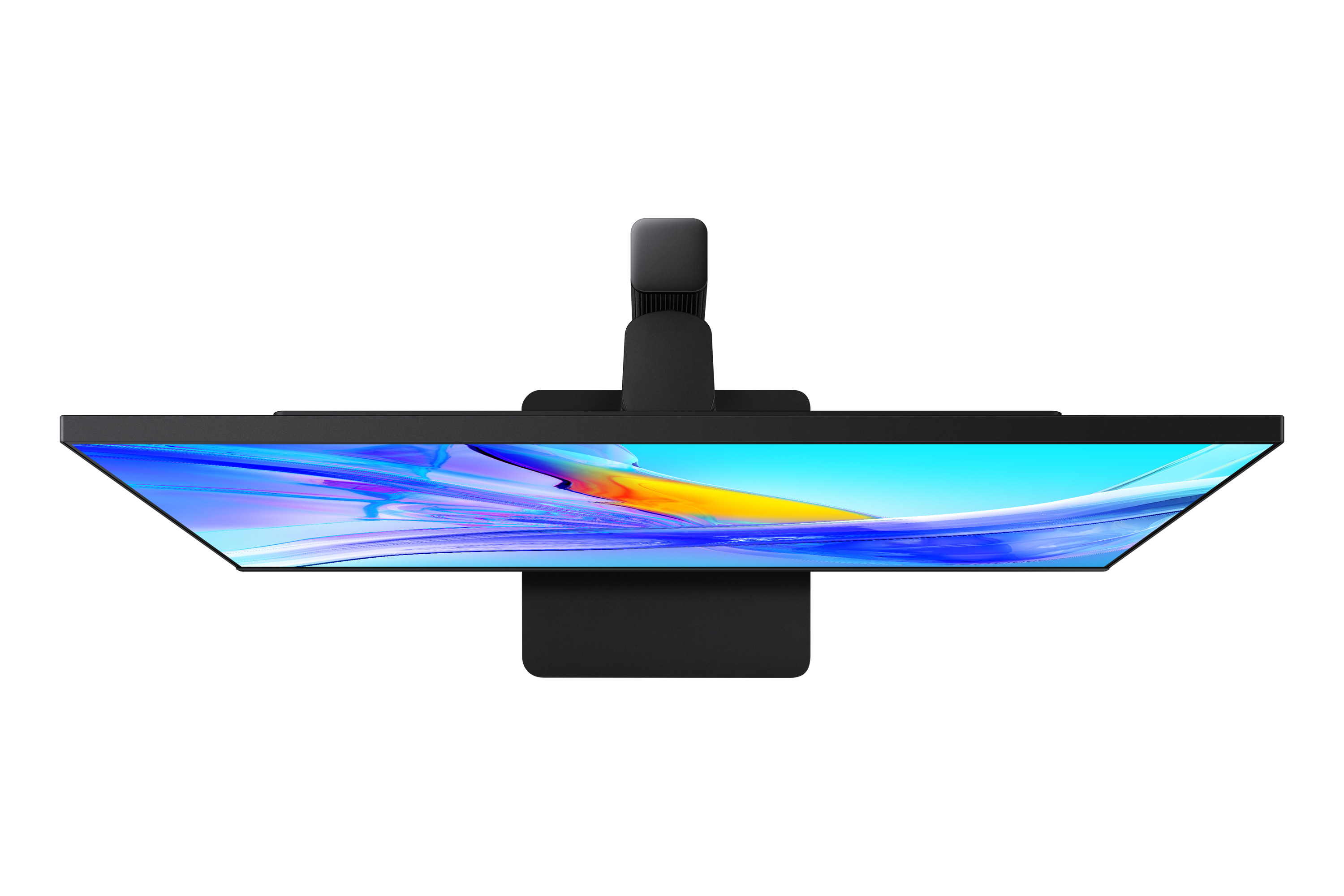 Czarny monitor komputera widziany z góry. Ekran wyświetla kolorową grafikę.