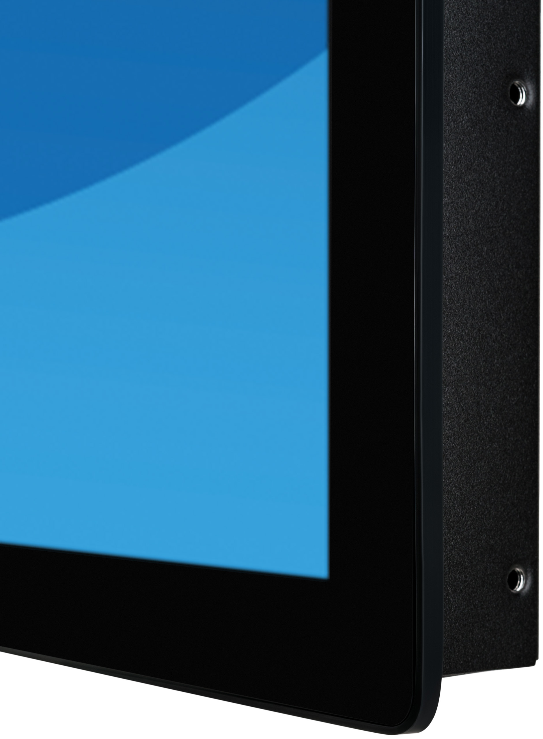 Zbliżenie rogu monitora, czarna ramka, niebieski ekran i czarny tył.