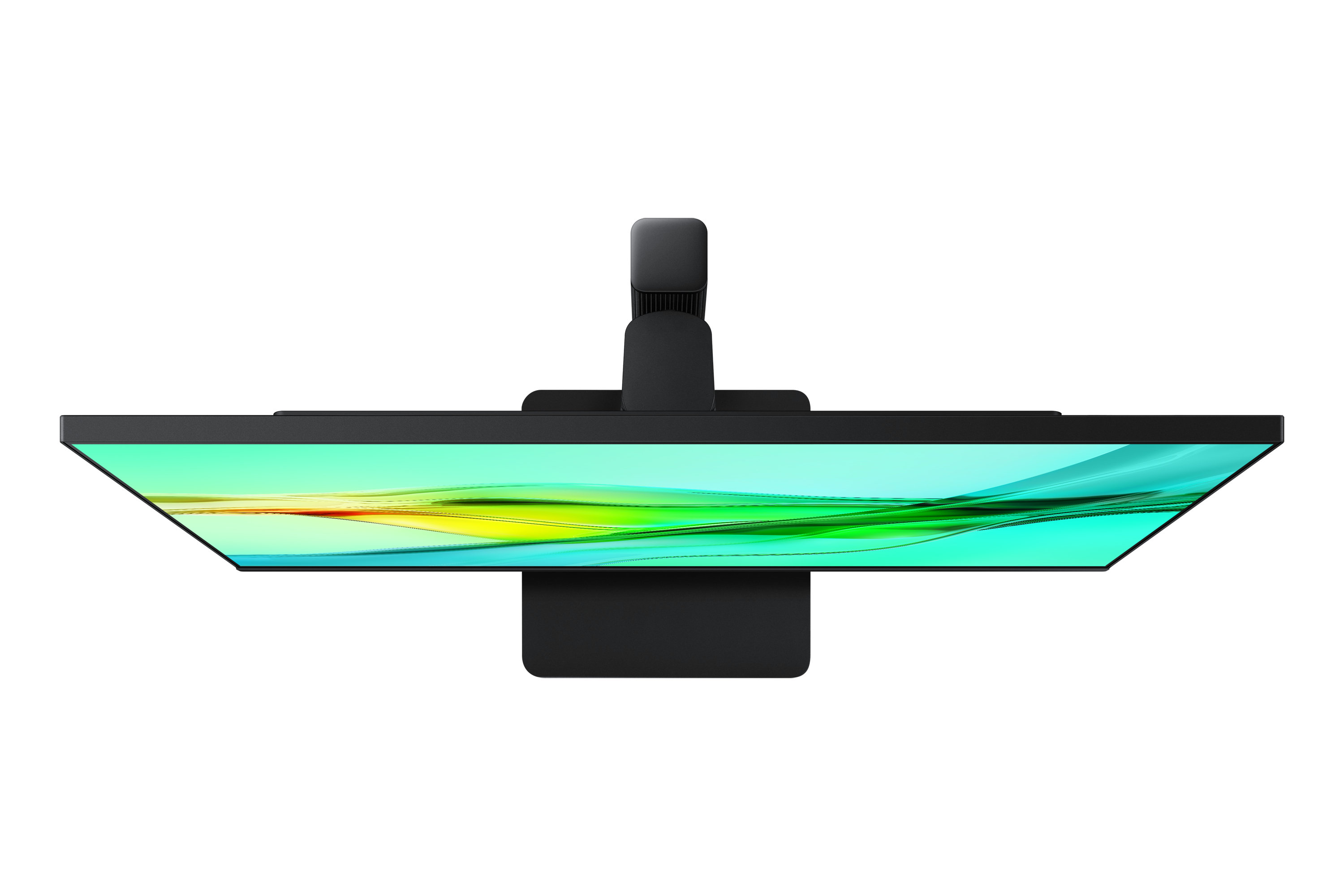 Widok z góry czarnego monitora na biurku, wyświetlającego kolorowe tło.