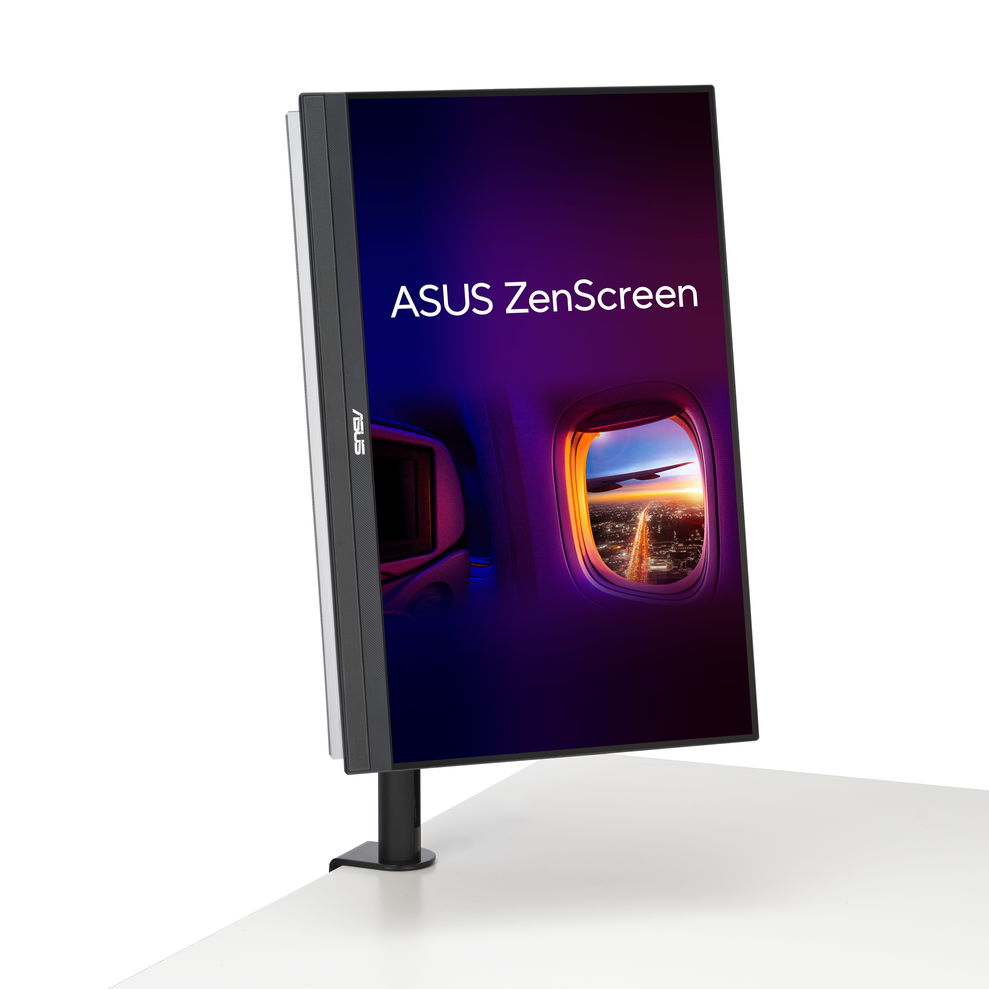 Monitor ASUS ZenScreen w trybie portretowym wyświetlający widok z okna samolotu.