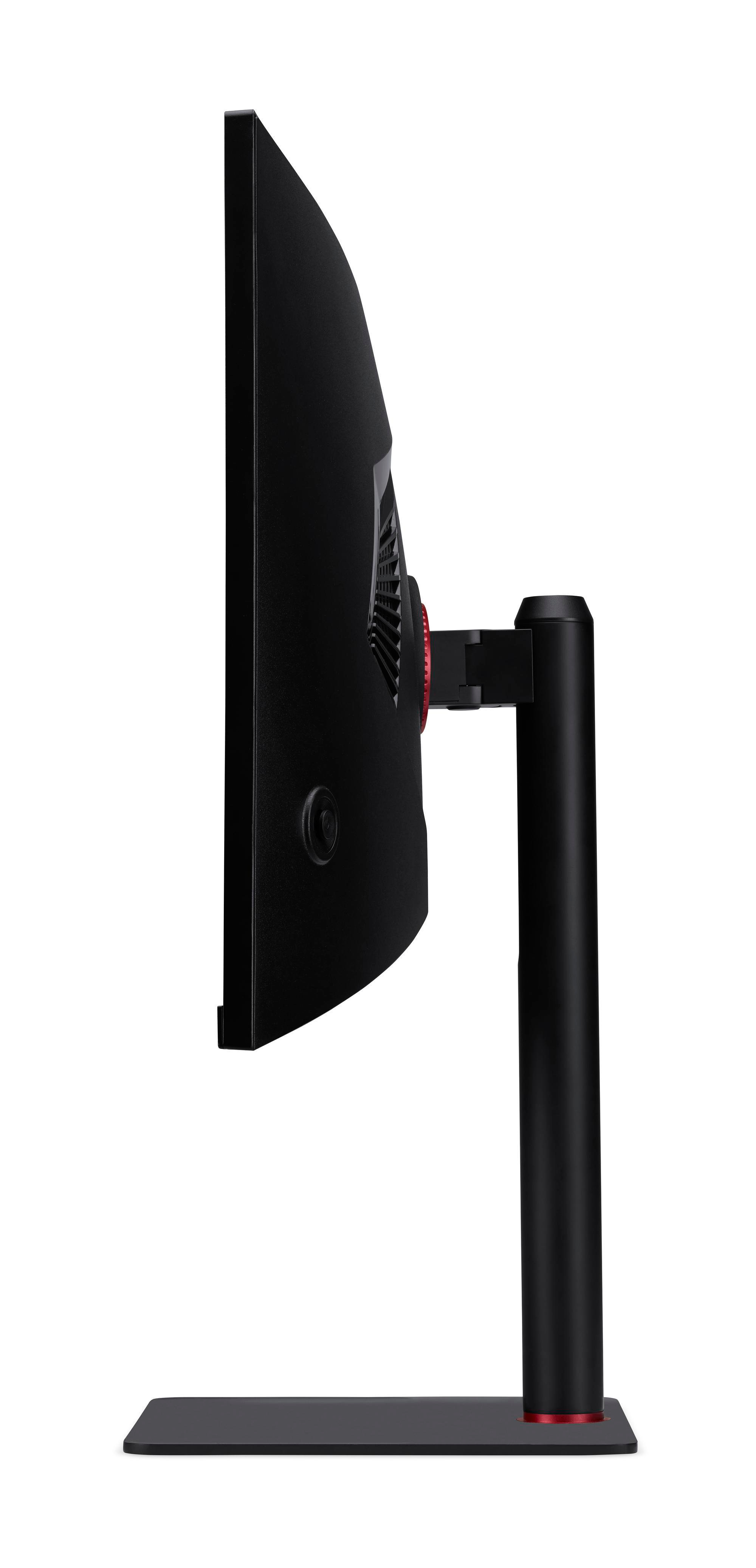 Widok z boku zakrzywionego monitora, czarny z czerwonymi akcentami. Stoi na czarnym stojaku.