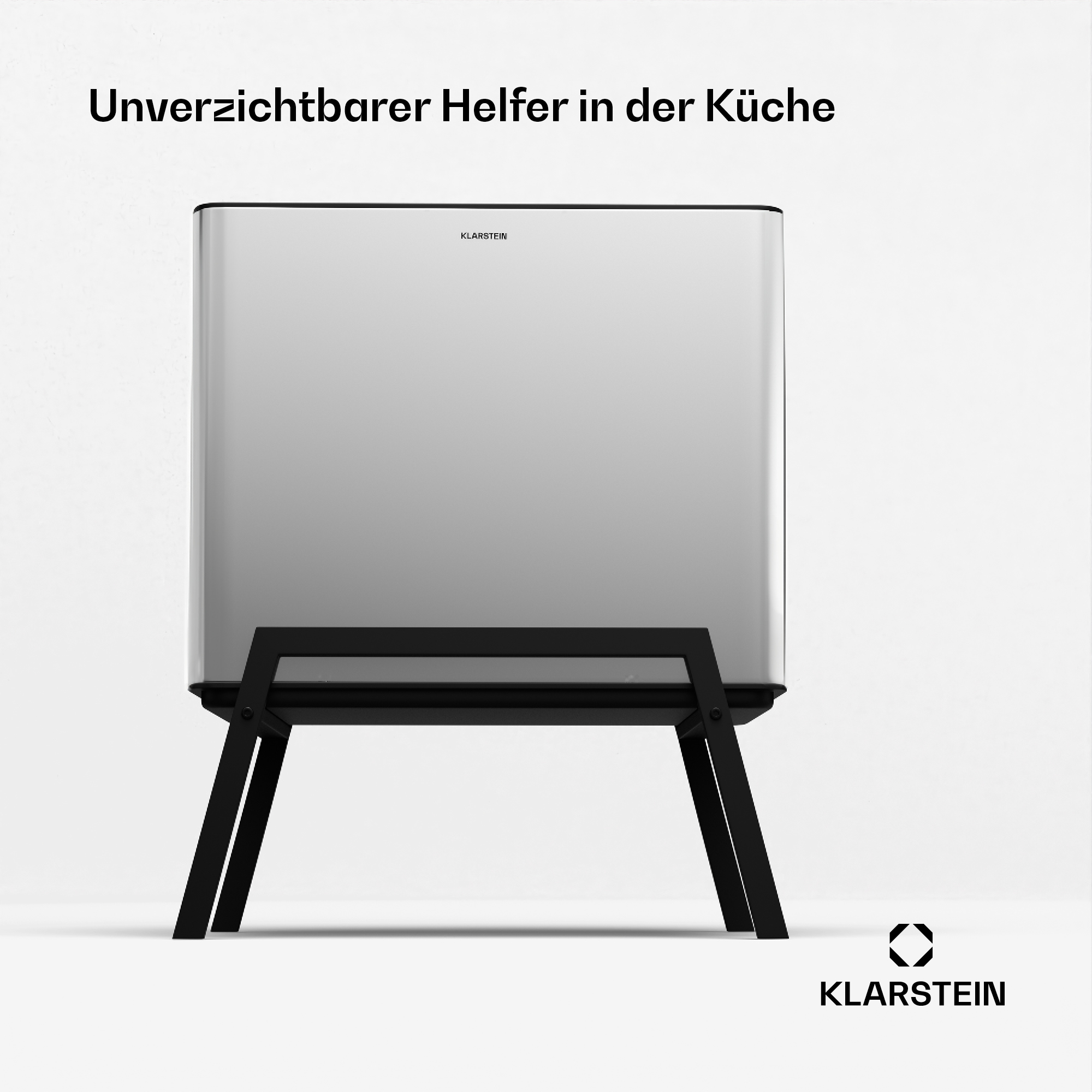Un elettrodomestico da cucina rettangolare argentato su un supporto nero. Il testo dice 'Unverzichtbarer Helfer in der Küche'.