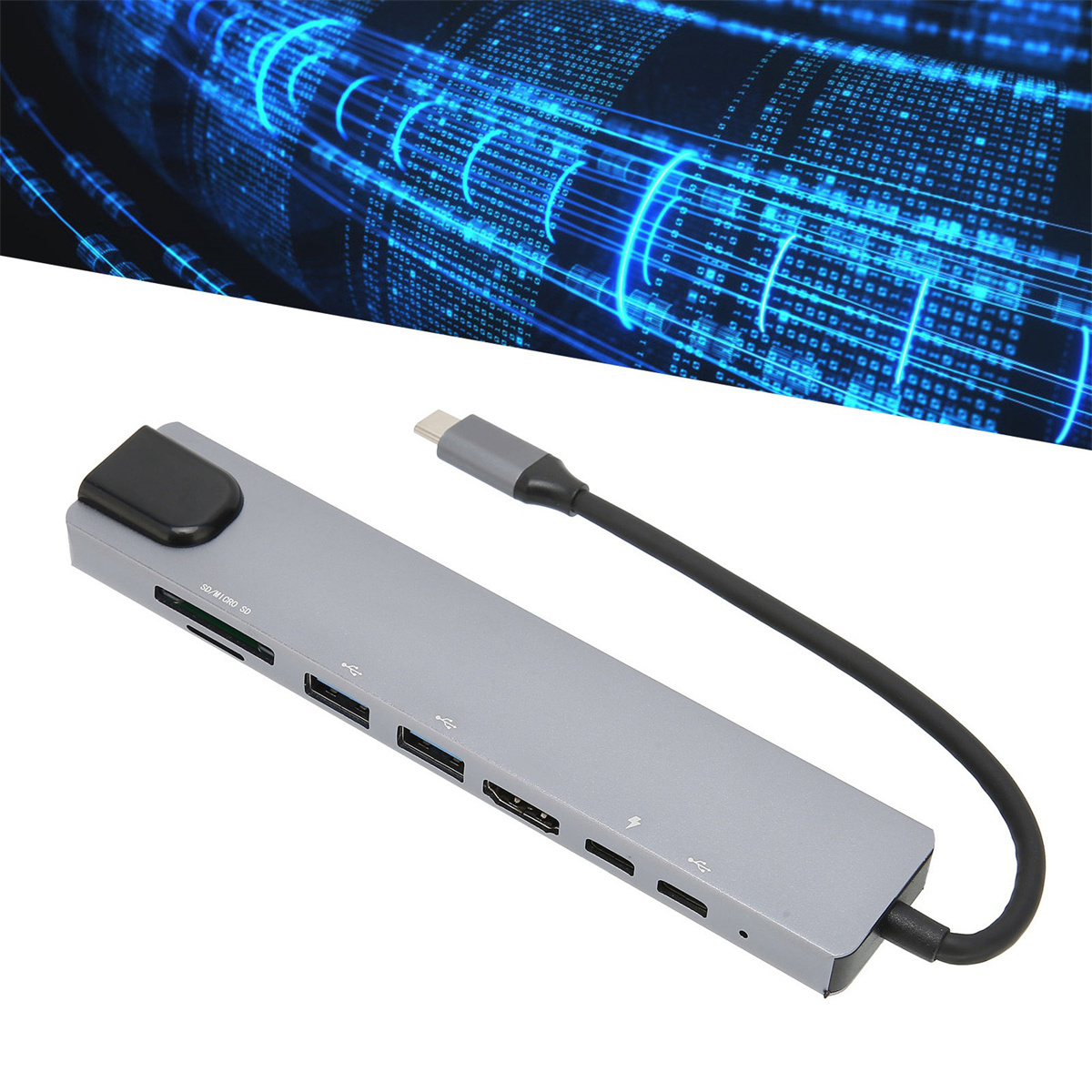 Ein grauer USB-Hub mit verschiedenen Anschlüssen und einem schwarzen Kabel, auf weißem Hintergrund.