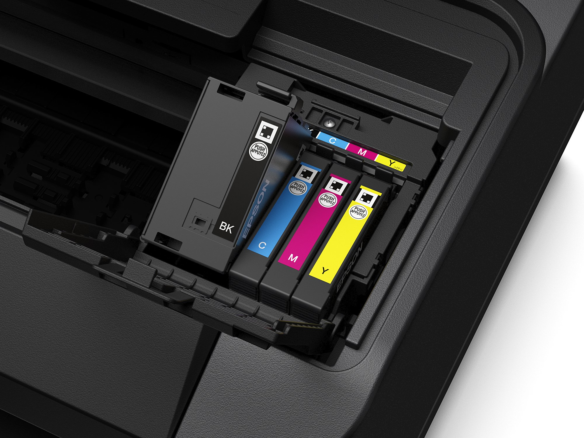 Cartucce di inchiostro per stampante in una stampante. Le cartucce sono di colore nero, ciano, magenta e giallo.