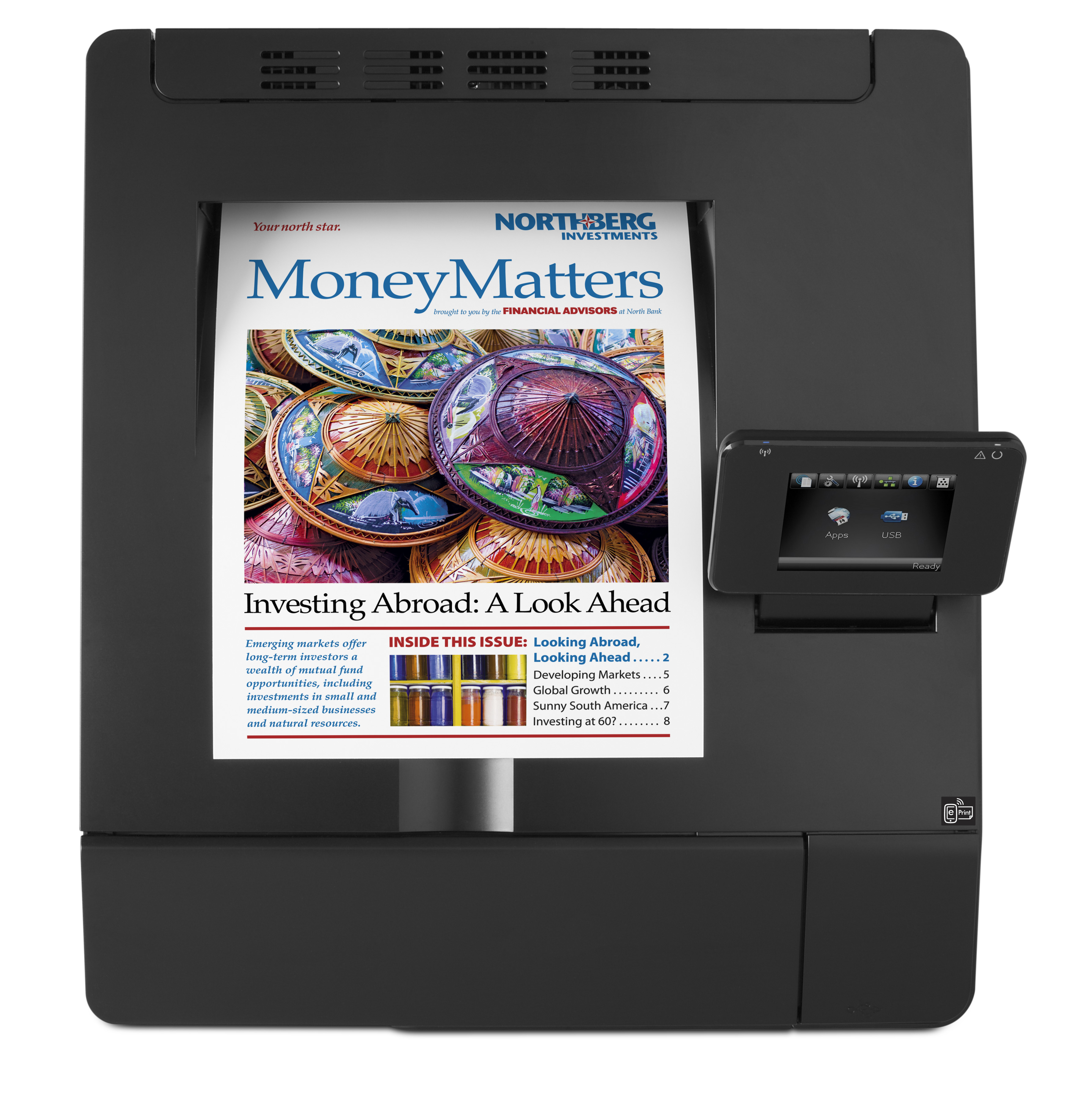 Una stampante nera con touchscreen che mostra la copertina di una rivista. La rivista si intitola 'Money Matters'.