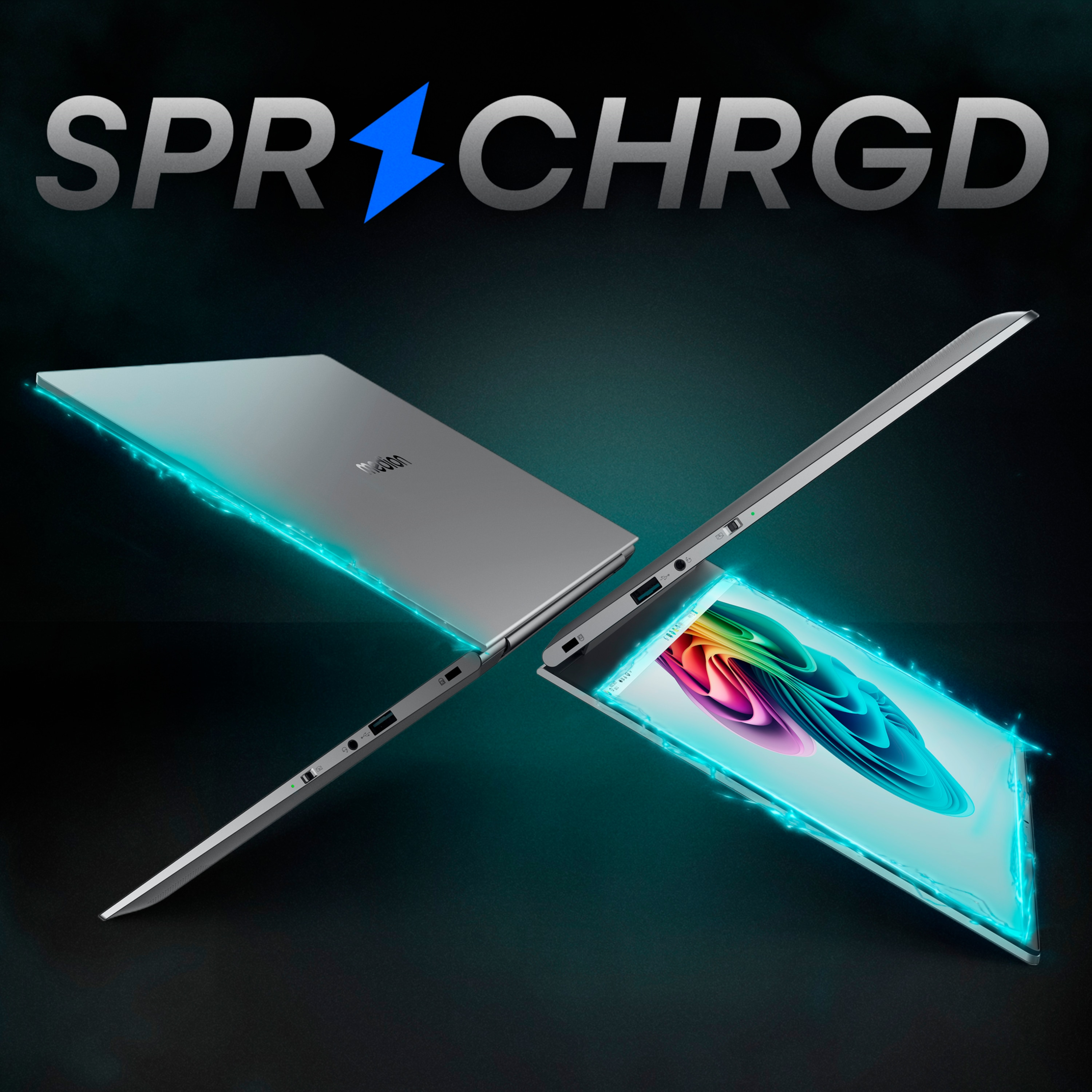 Srebrny laptop z niebieskim błyskiem i napisem SPR CHRGD. Otwarty, pokazujący ekran.