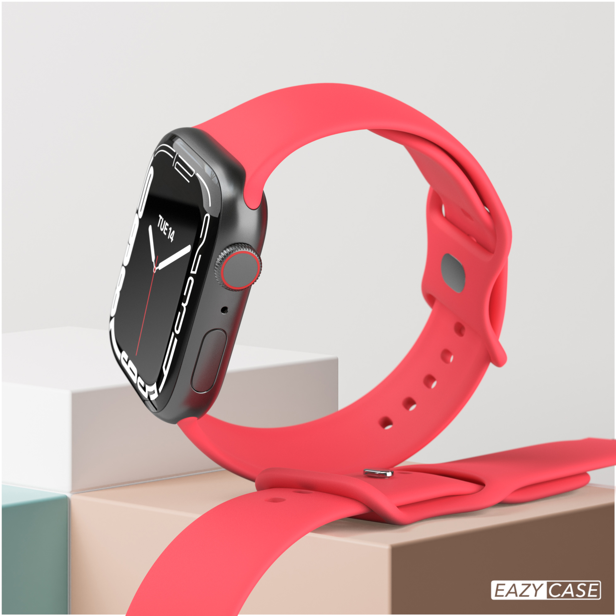 Eine rote Smartwatch mit schwarzem Bildschirm auf einer weißen Oberfläche. Das rote Band ist befestigt.