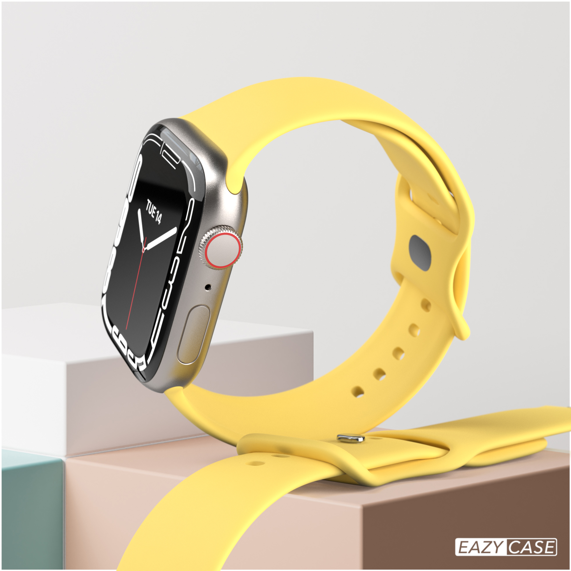 Gelbe Smartwatch mit gelbem Armband. Die Uhr steht auf einem weißen und cremefarbenen Ständer.