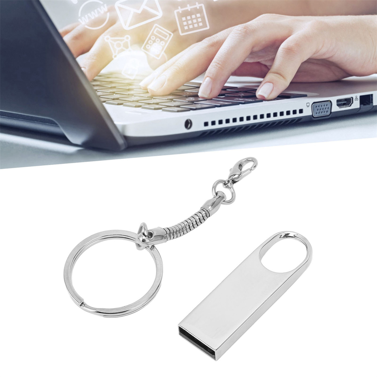 Eine Laptop-Tastatur mit einem Schlüsselanhänger und einem silbernen USB-Stick daneben, auf weißem Hintergrund.