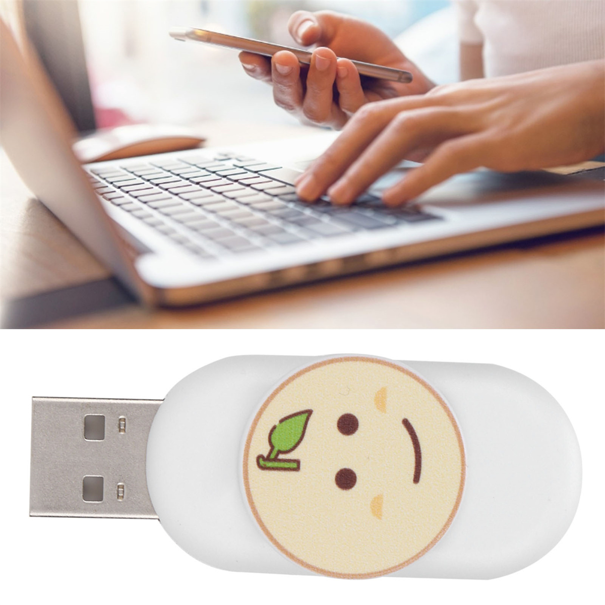Frau benutzt Laptop und hält Telefon. USB-Stick unter dem Laptop.