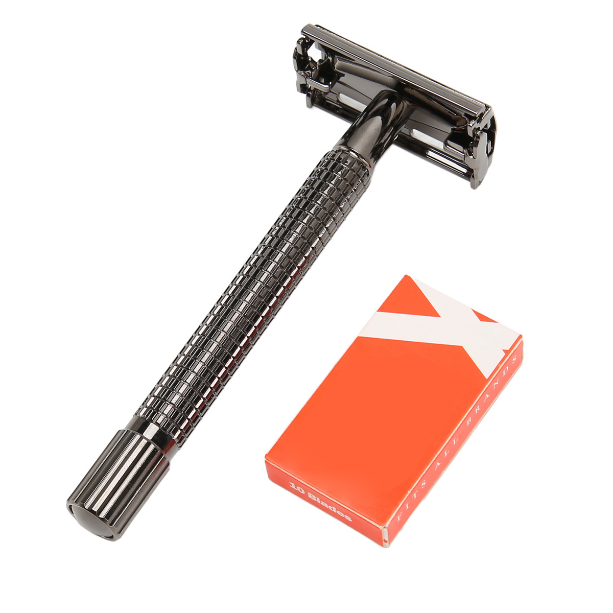 Schwarzer Metallrasierer mit schwarzem Griff. Daneben eine orangefarbene Klingenbox.