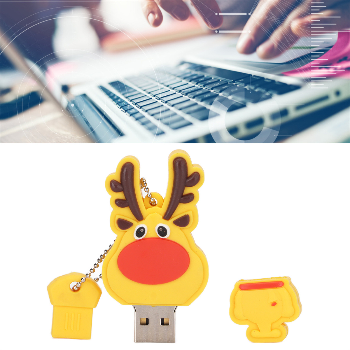 USB-Stick mit Rentier-Design neben einem Laptop.