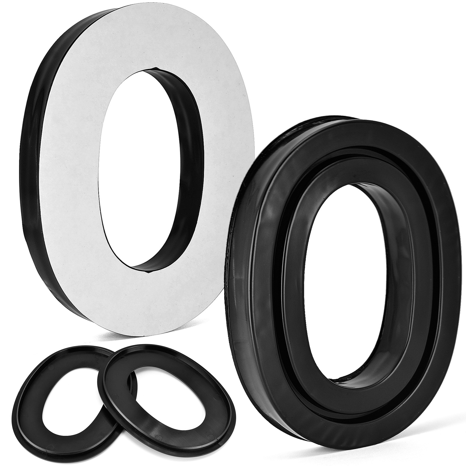 Dwie czarne i dwie białe okrągłe piankowe nauszniki. Jeden biały jest odklejony.