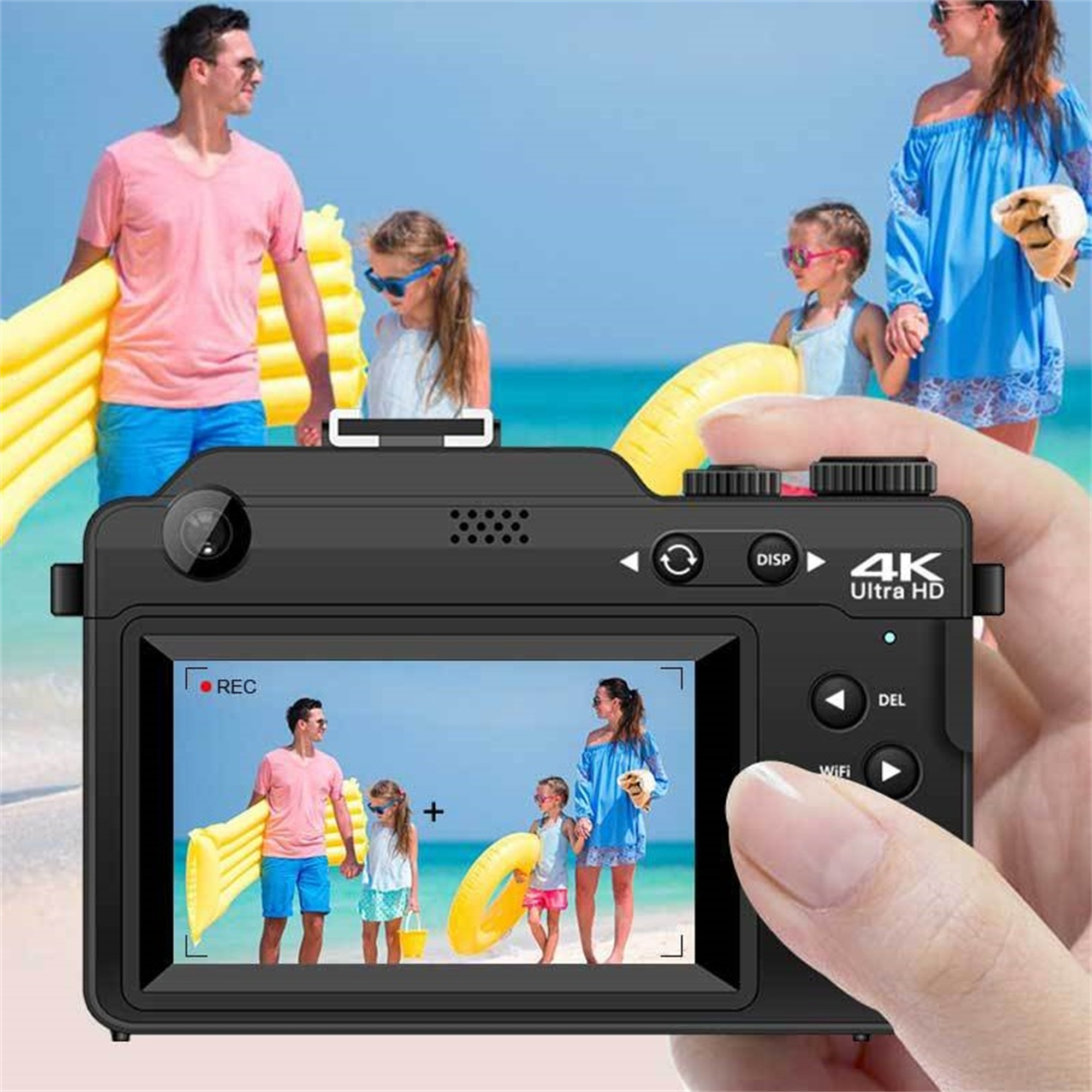Eine schwarze Digitalkamera zeigt eine Strandszene. Sie zeigt eine Familie am Strand mit hellem Himmel.
