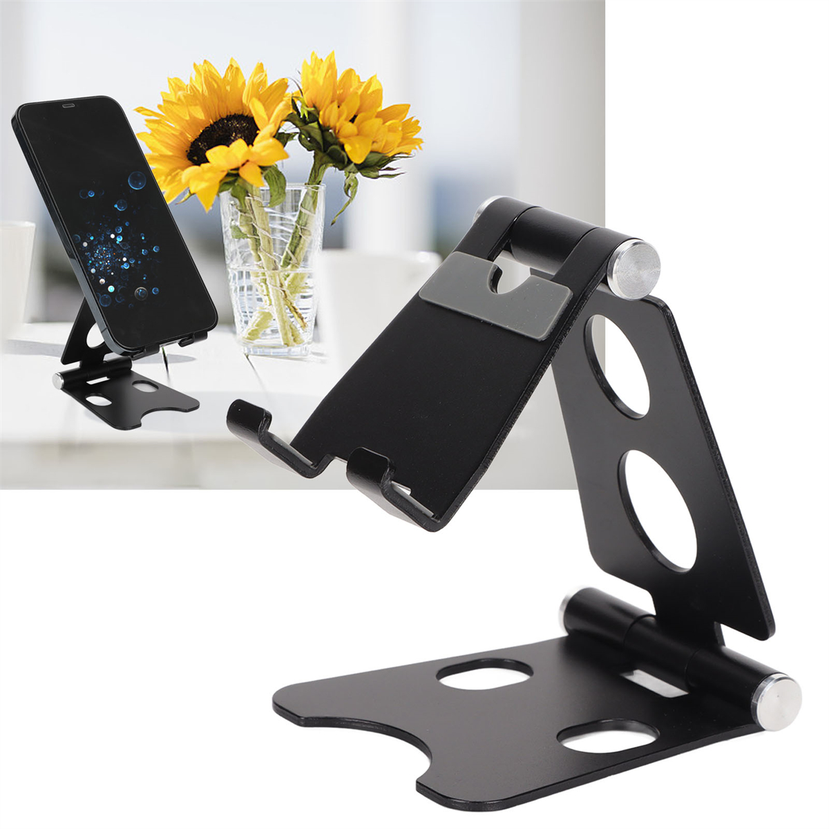 Schwarzer Telefonständer mit Telefon. Gelbe Sonnenblumen in einer Glasvase im Hintergrund.