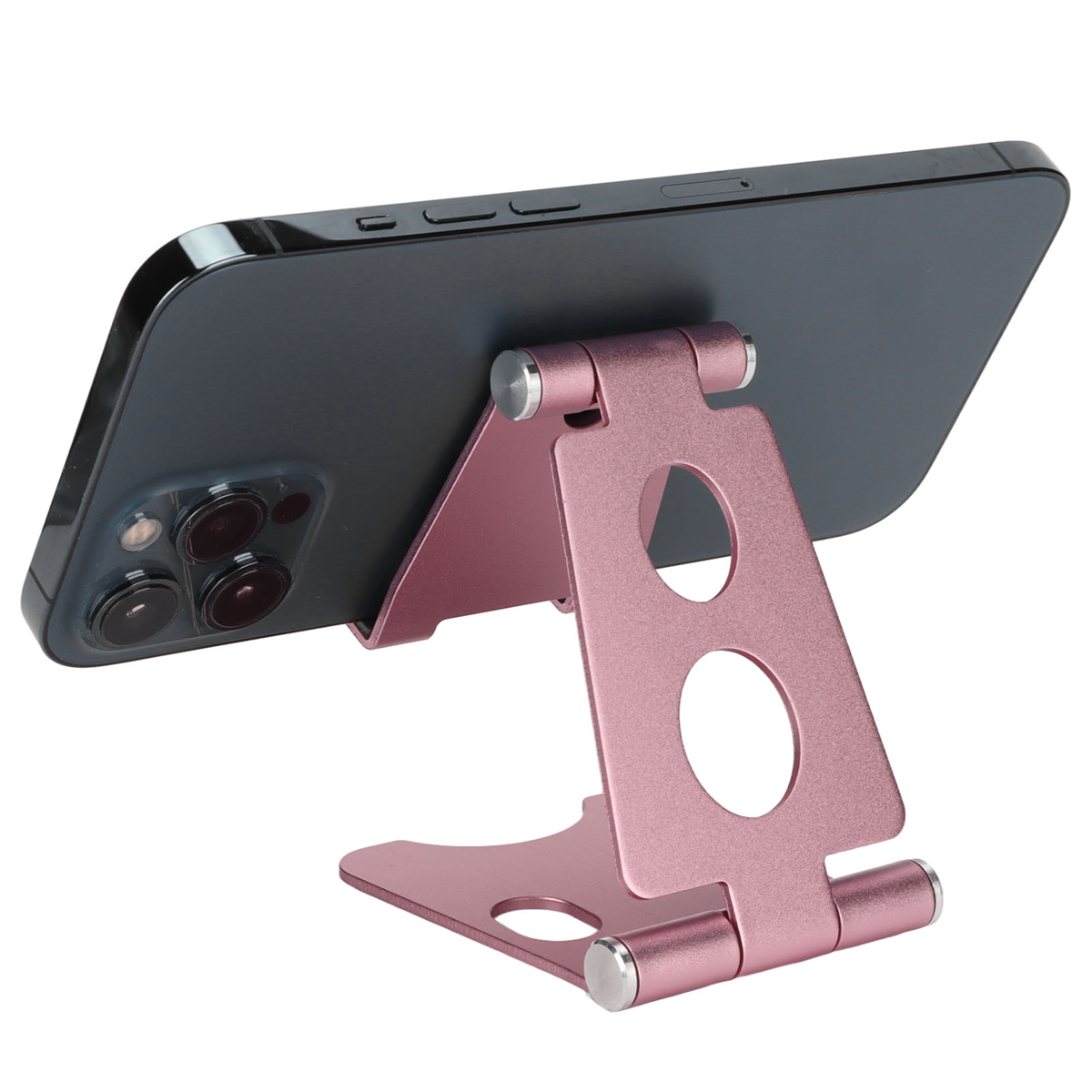 Ein rosa Telefonständer, der ein schwarzes Telefon hält, abgewinkelt zur Betrachtung auf einer weißen Oberfläche.