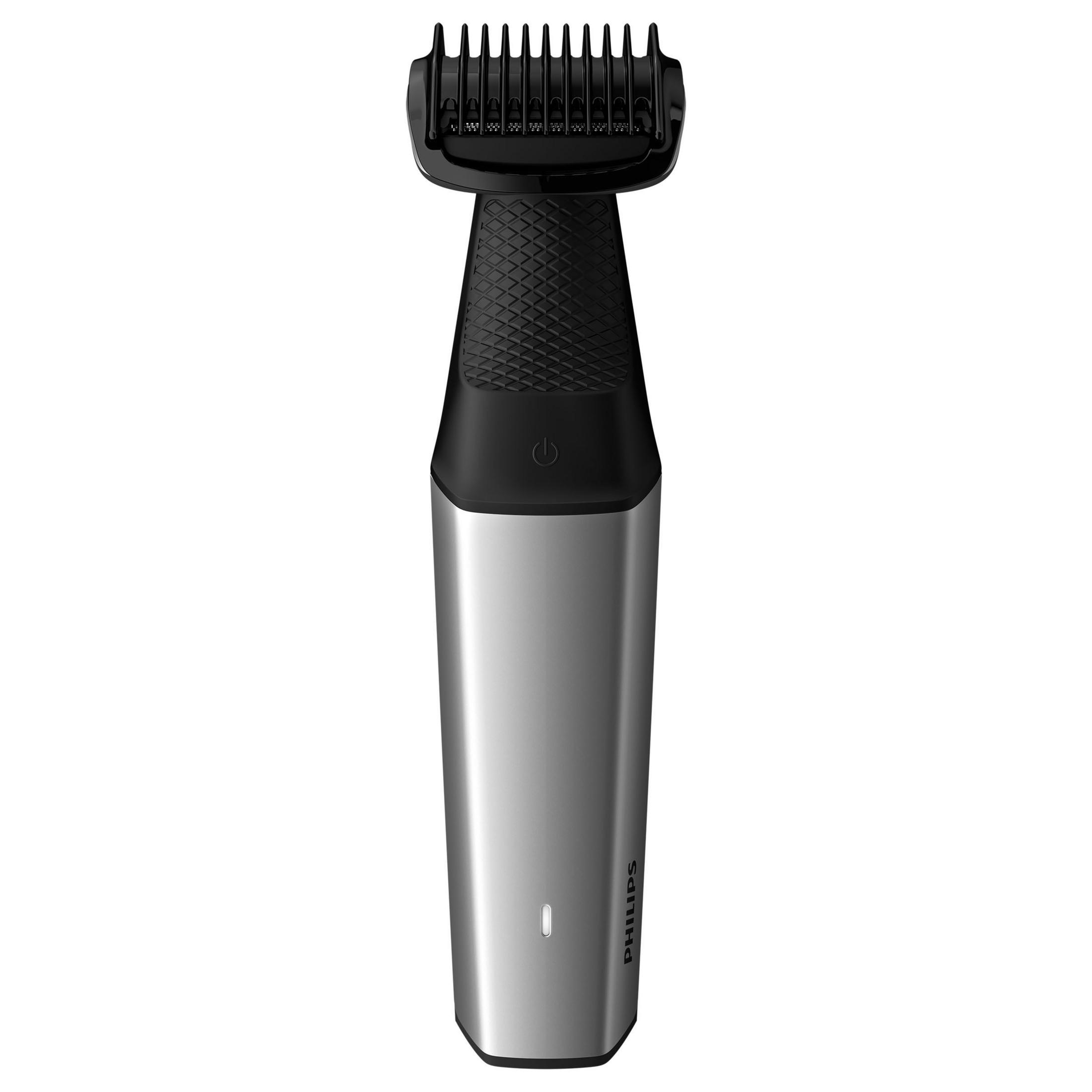 Afeitadora Philips plateada y negra. Tiene un accesorio de peine negro y un botón de encendido.