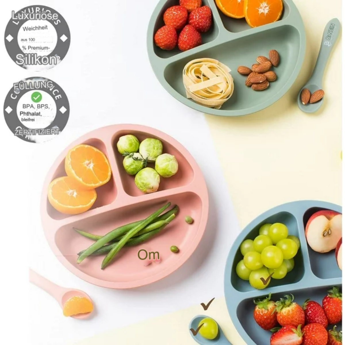 Geteilter Babyteller mit Essen: Orangen, Bohnen, Rosenkohl, Pasta und Erdbeeren. Grün und Pink.