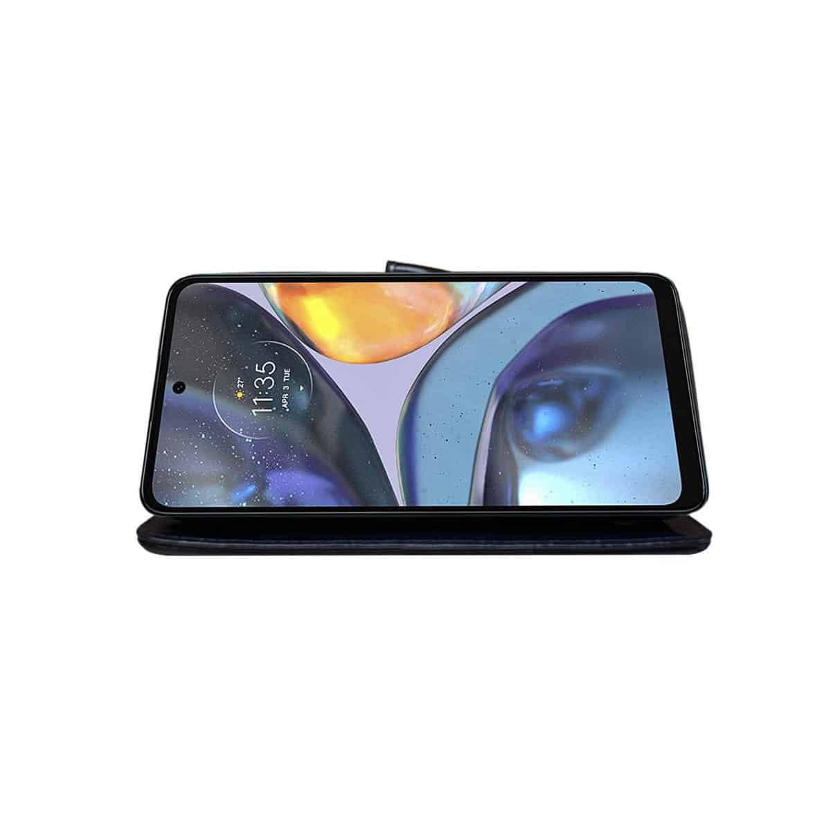 Motorola-Telefon in schwarzem Gehäuse. Der Bildschirm zeigt ein verschwommenes Bild mit der Uhrzeit 11:35.
