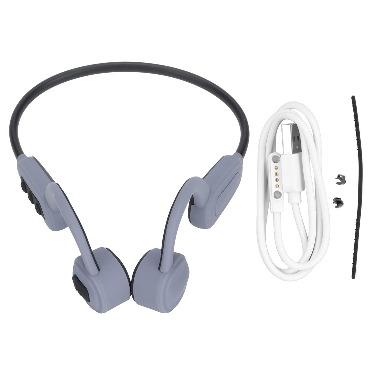 Graue Knochenschallkopfhörer mit Ladekabel und kleinem Zubehör.