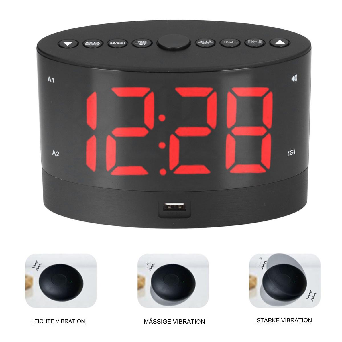 Ein schwarzer digitaler Wecker mit roten Ziffern, der 12:28 anzeigt. Darunter werden drei Vibrationseinstellungen angezeigt.