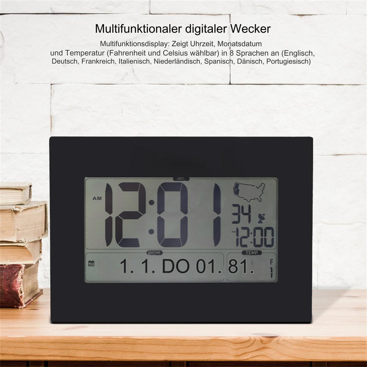 Schwarze Digitaluhr mit Uhrzeit und Datum, auf einem Holztisch, mit Text darüber.