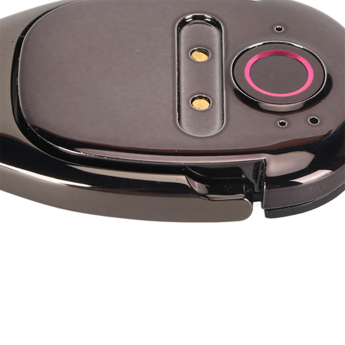 Nahaufnahme eines schwarzen Geräts mit rotem Licht und goldenen Punkten.