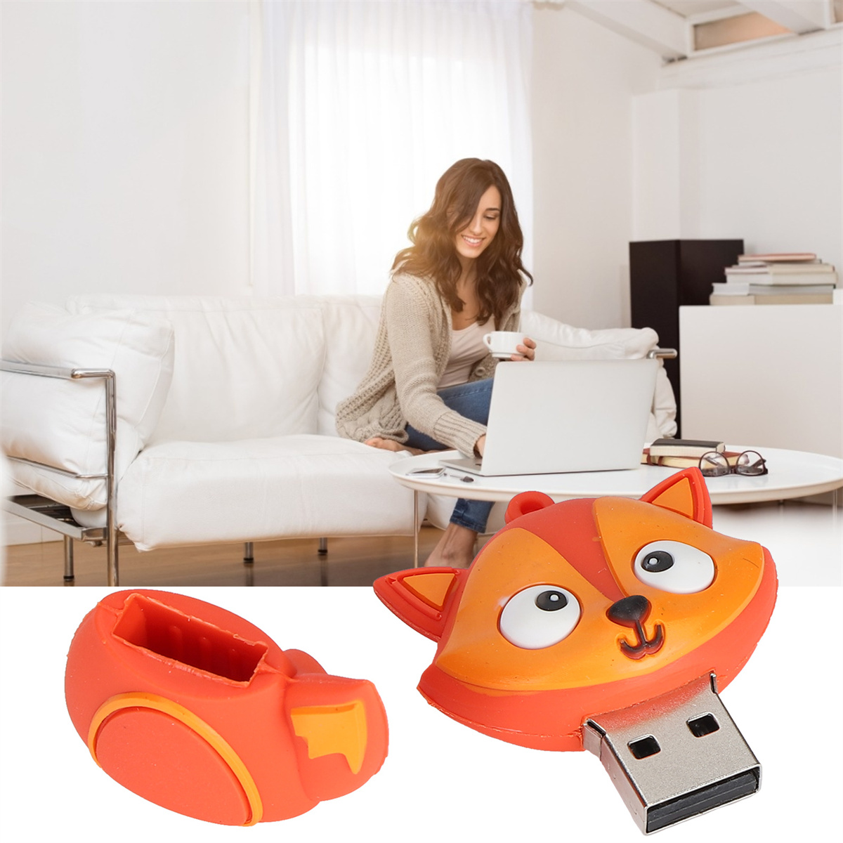 Förmiger oranger USB-Stick und eine Frau, die im Hintergrund an einem Laptop arbeitet.