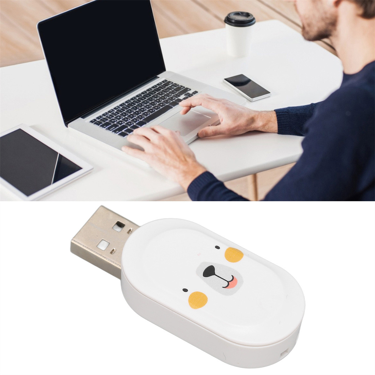 Eine Person benutzt einen Laptop, daneben ein Tablet und Telefon, sowie ein USB-Stick.