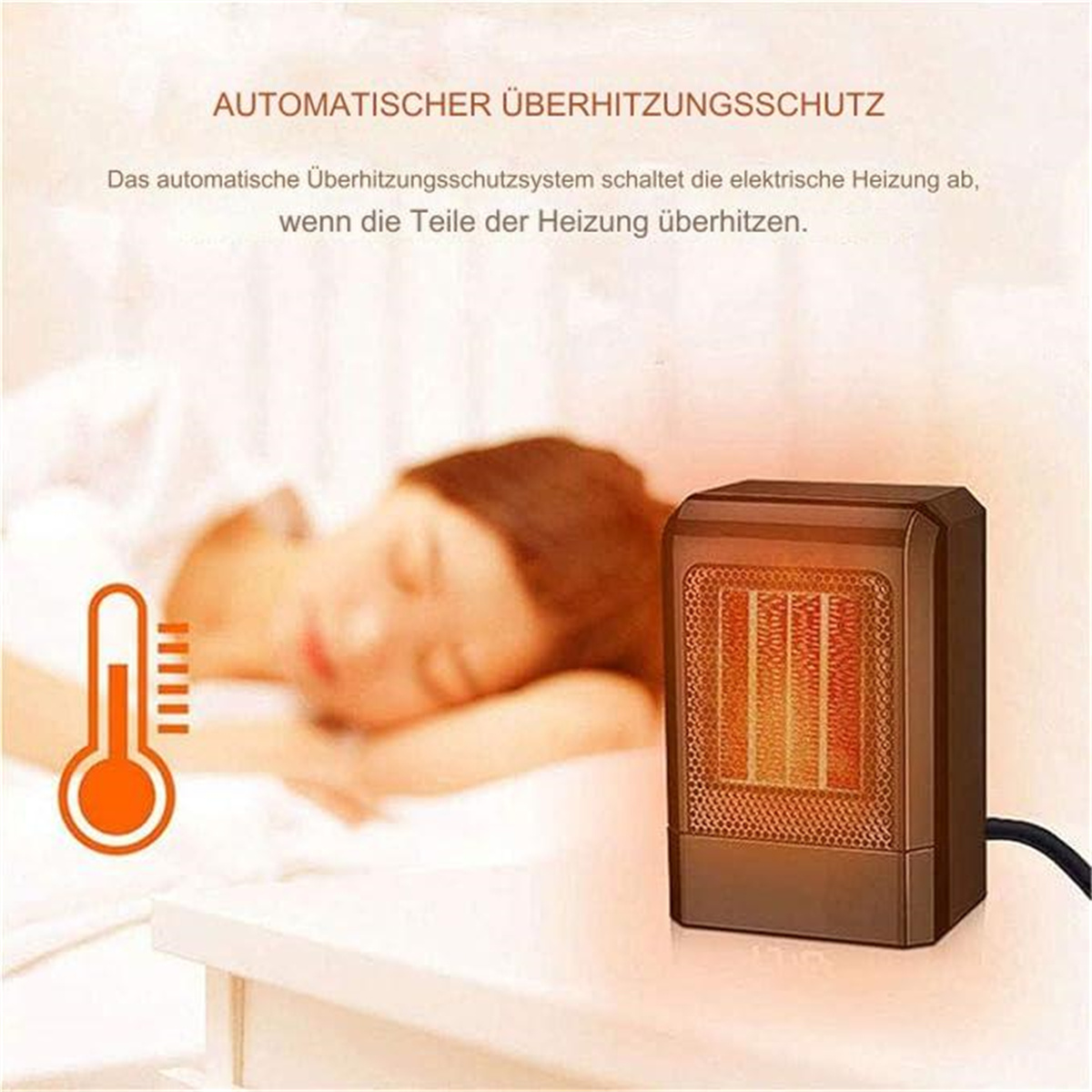 Kleiner brauner Heizlüfter mit rotem Thermometer. Eine Person schläft im Hintergrund.
